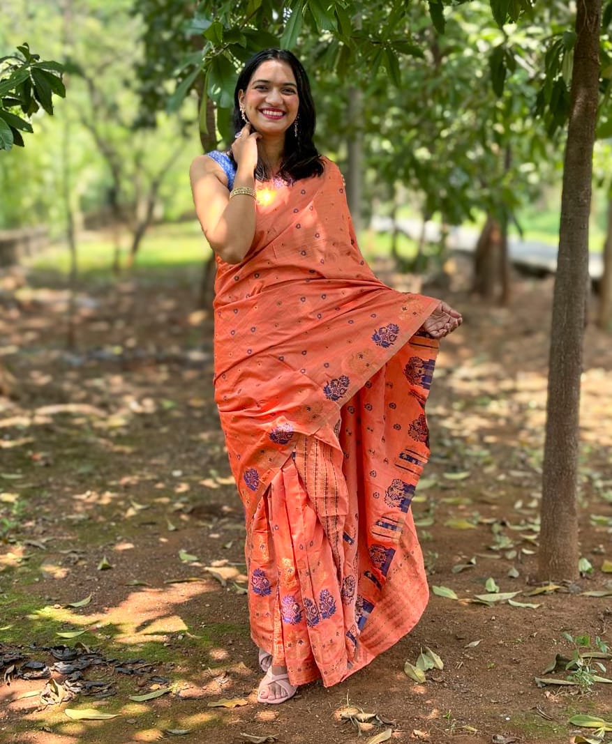 Devi Kaushiki Orange Handloom Mekhela Chador saree