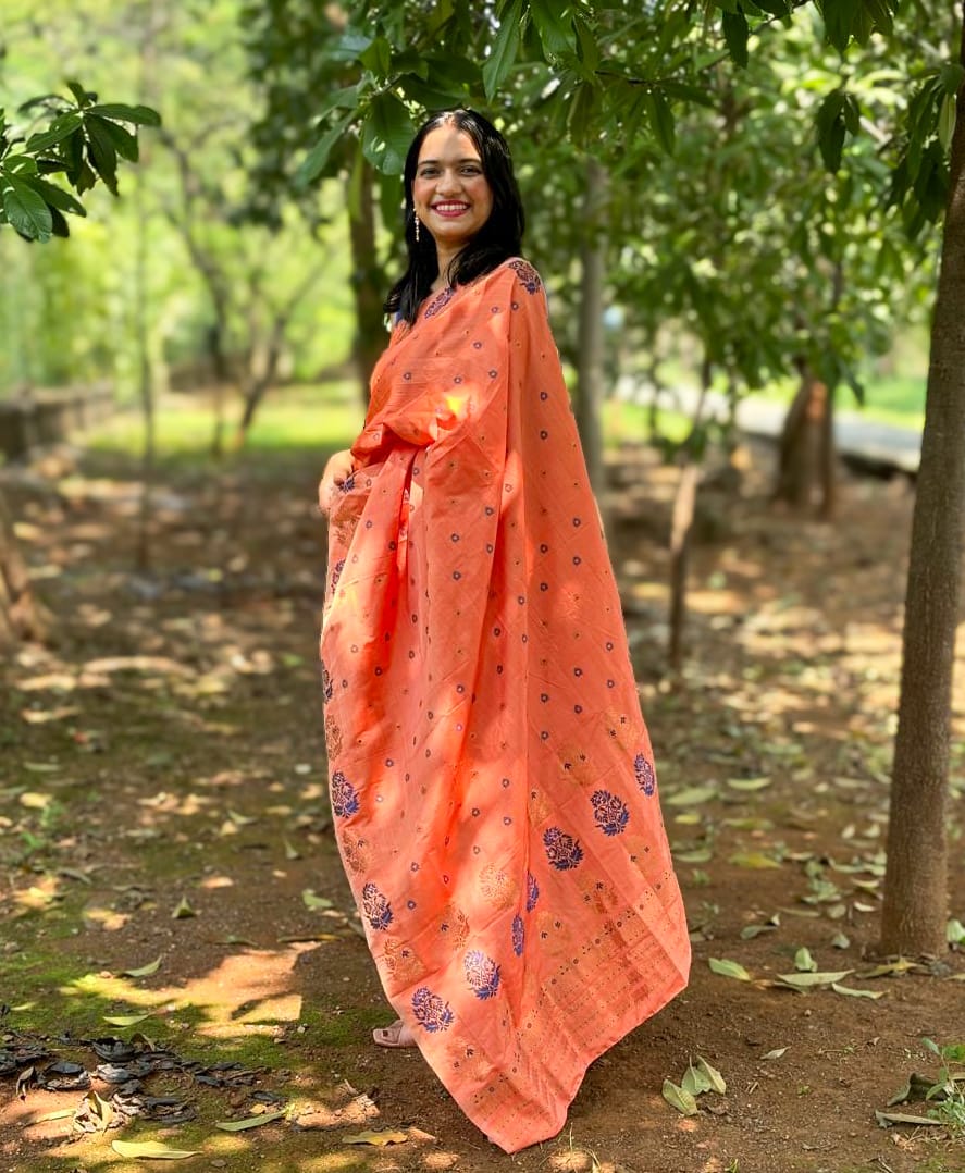 Devi Kaushiki Orange Handloom Mekhela Chador saree