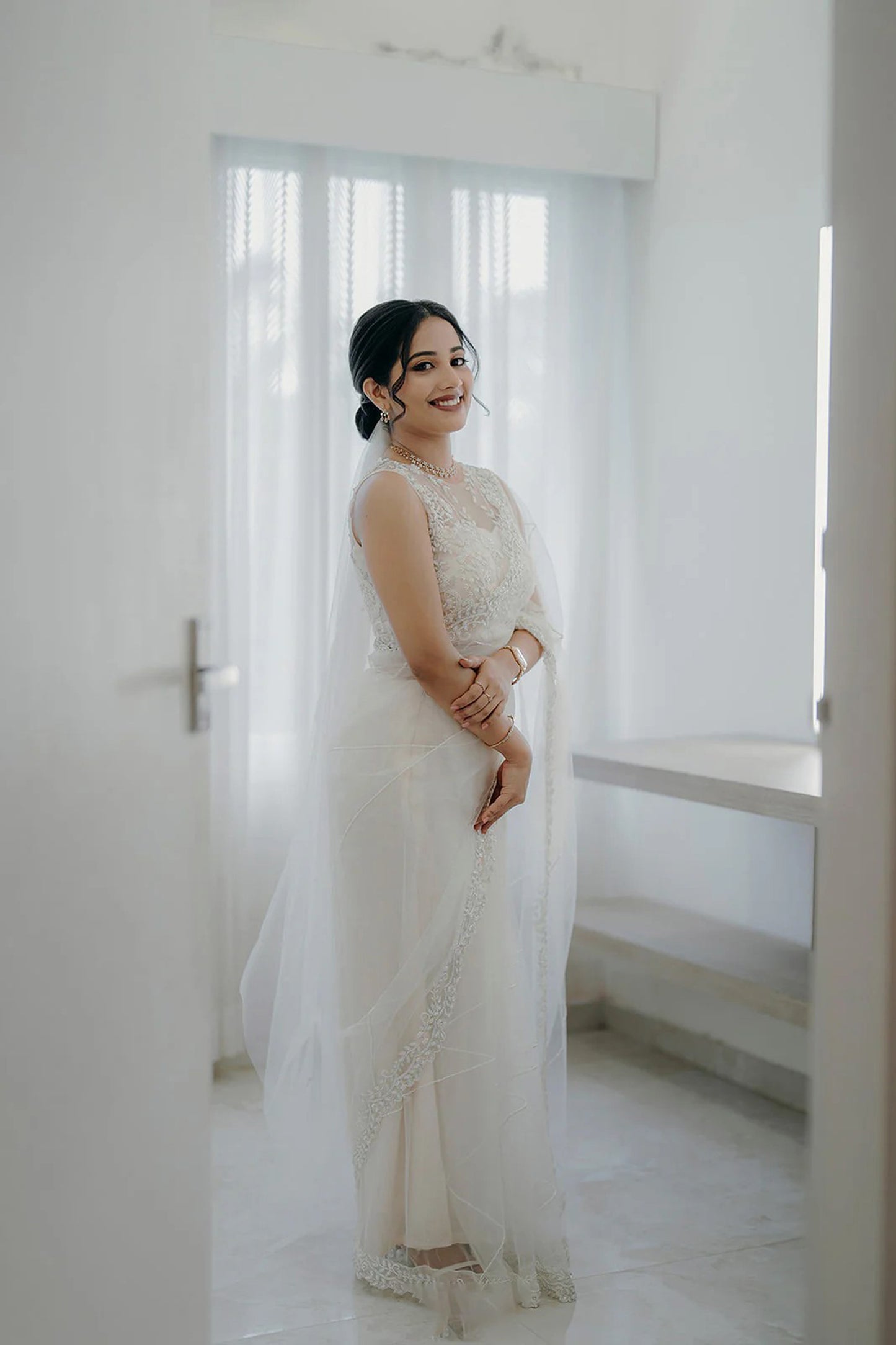 white bridal saree with very class hand embroidery of unique statement piece