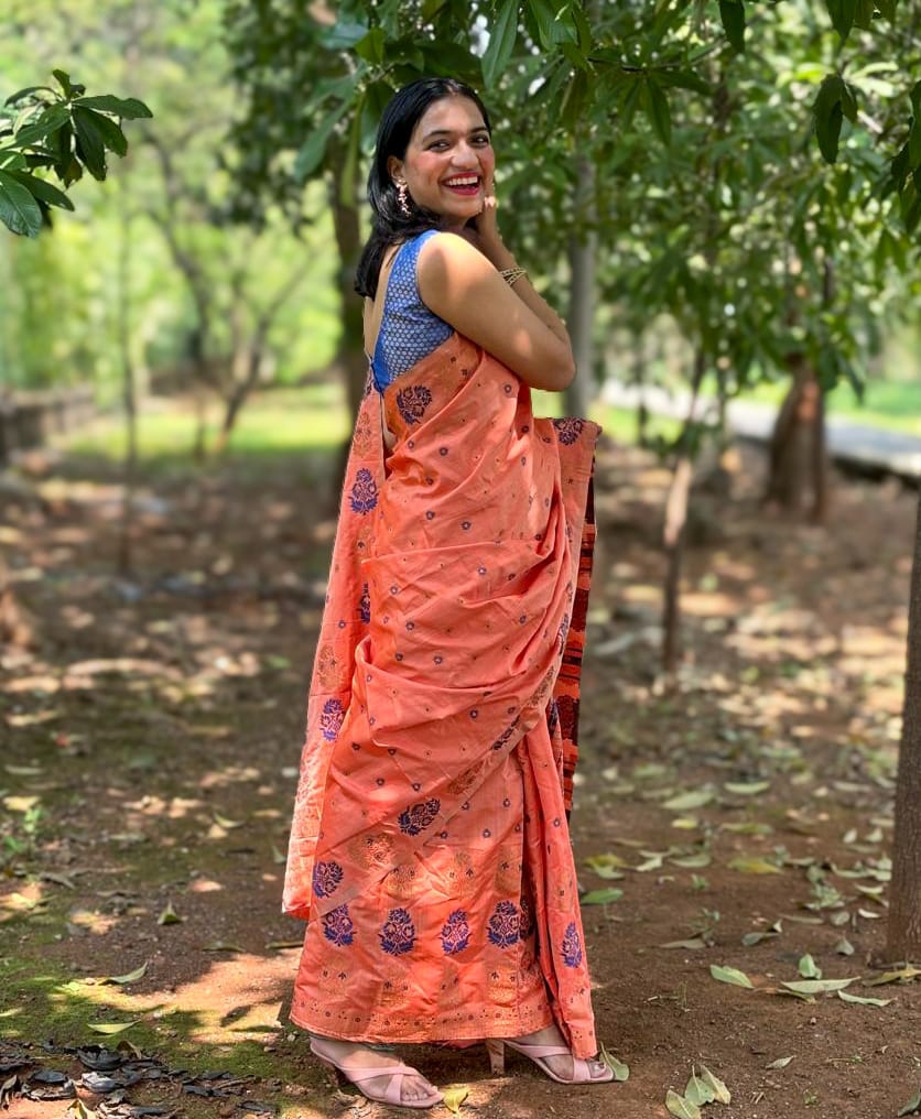 Devi Kaushiki Orange Handloom Mekhela Chador saree