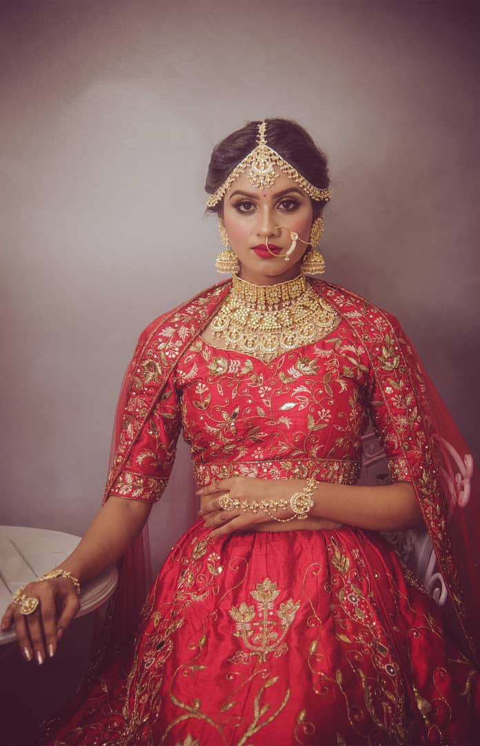 Red Raw Silk Leather and Aari work paradise lehenga