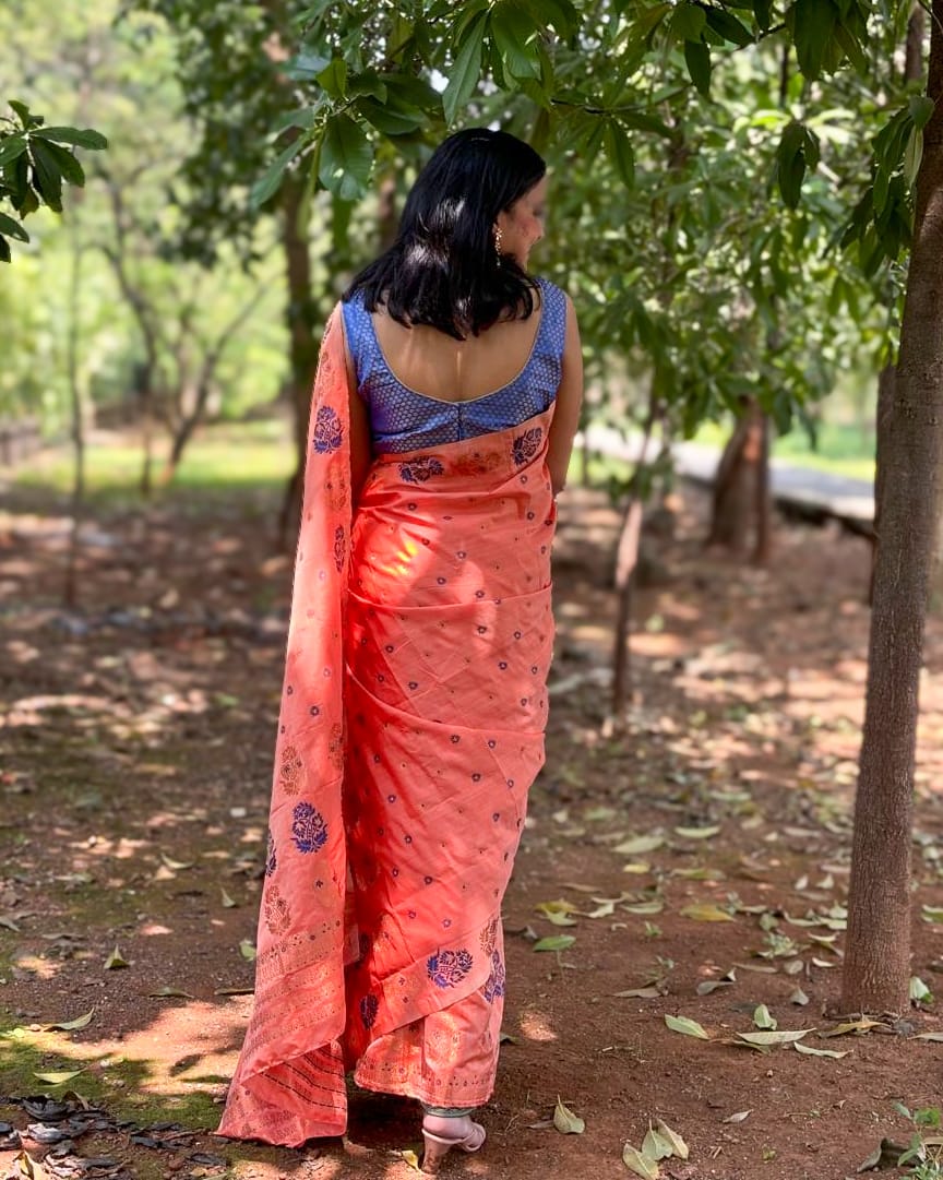 Devi Kaushiki Orange Handloom Mekhela Chador saree