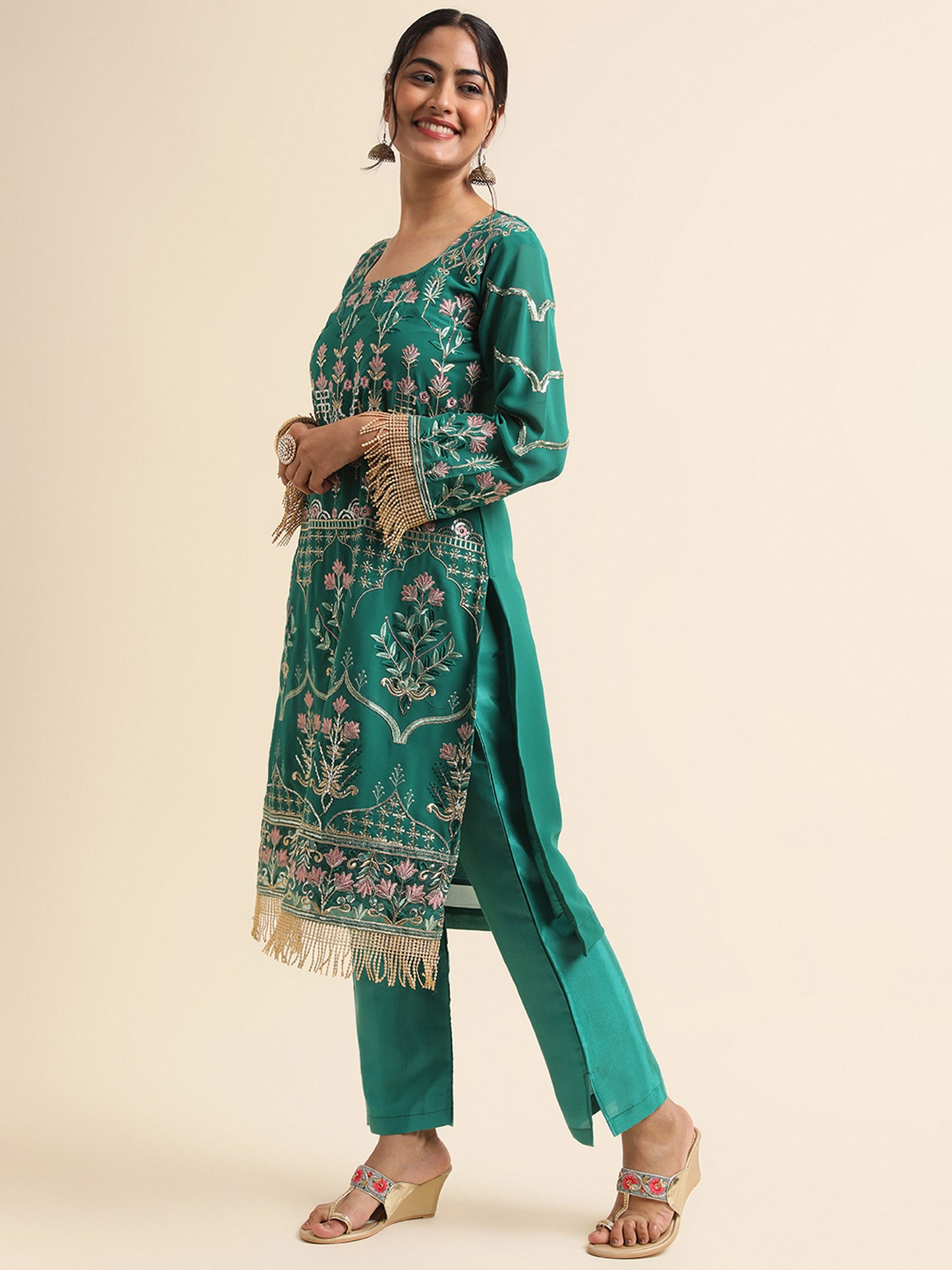 Green  sequins embroidered Faux Georgette Surya pakistani suit