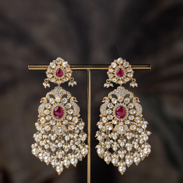 White Polki Studded with Peacock Motif Silver Earrings