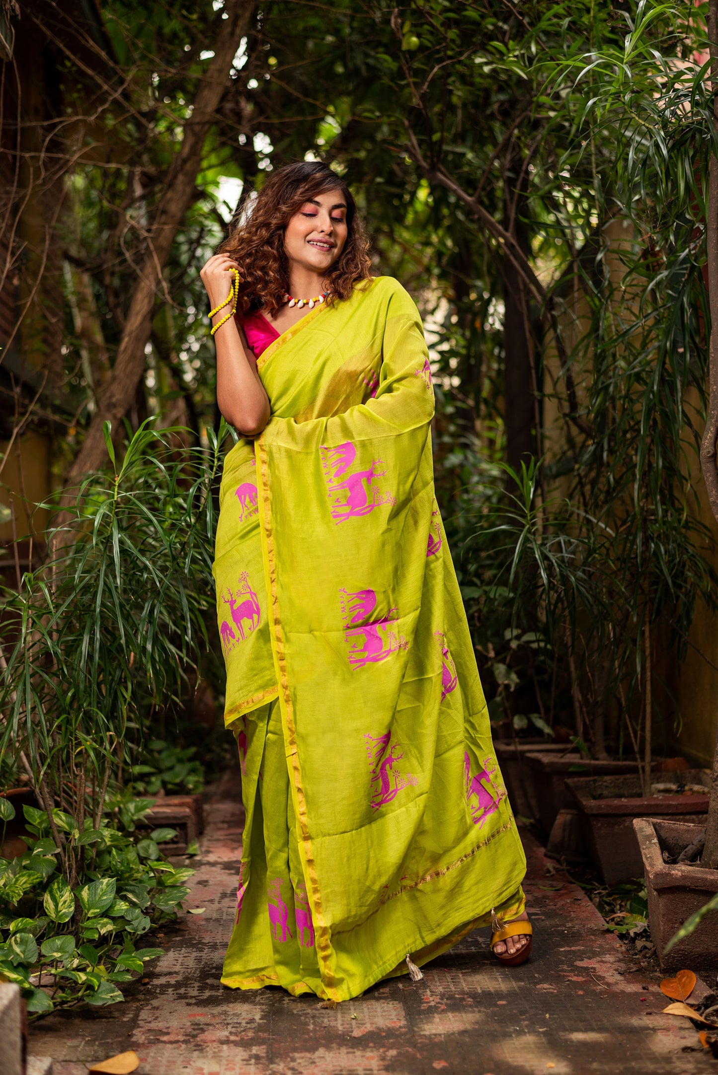 Green chanderi silk saree with ethnic deer motif