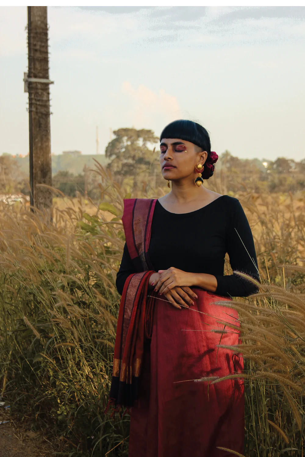 Maroon pure Tussar silk handloom saree with woven geometrical motifs and gold Zari border