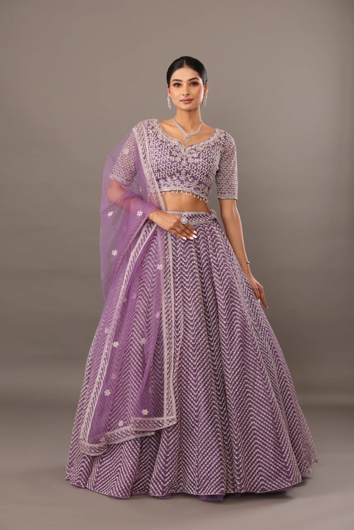 Lilac net base lehenga with embellishments bhas