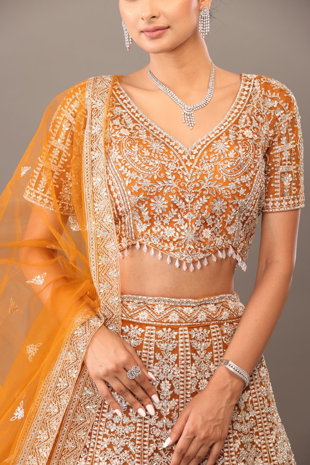 Yellow net lehenga with heavy white tread embroidery bhas