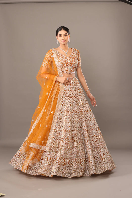 Yellow net lehenga with heavy white tread embroidery bhas