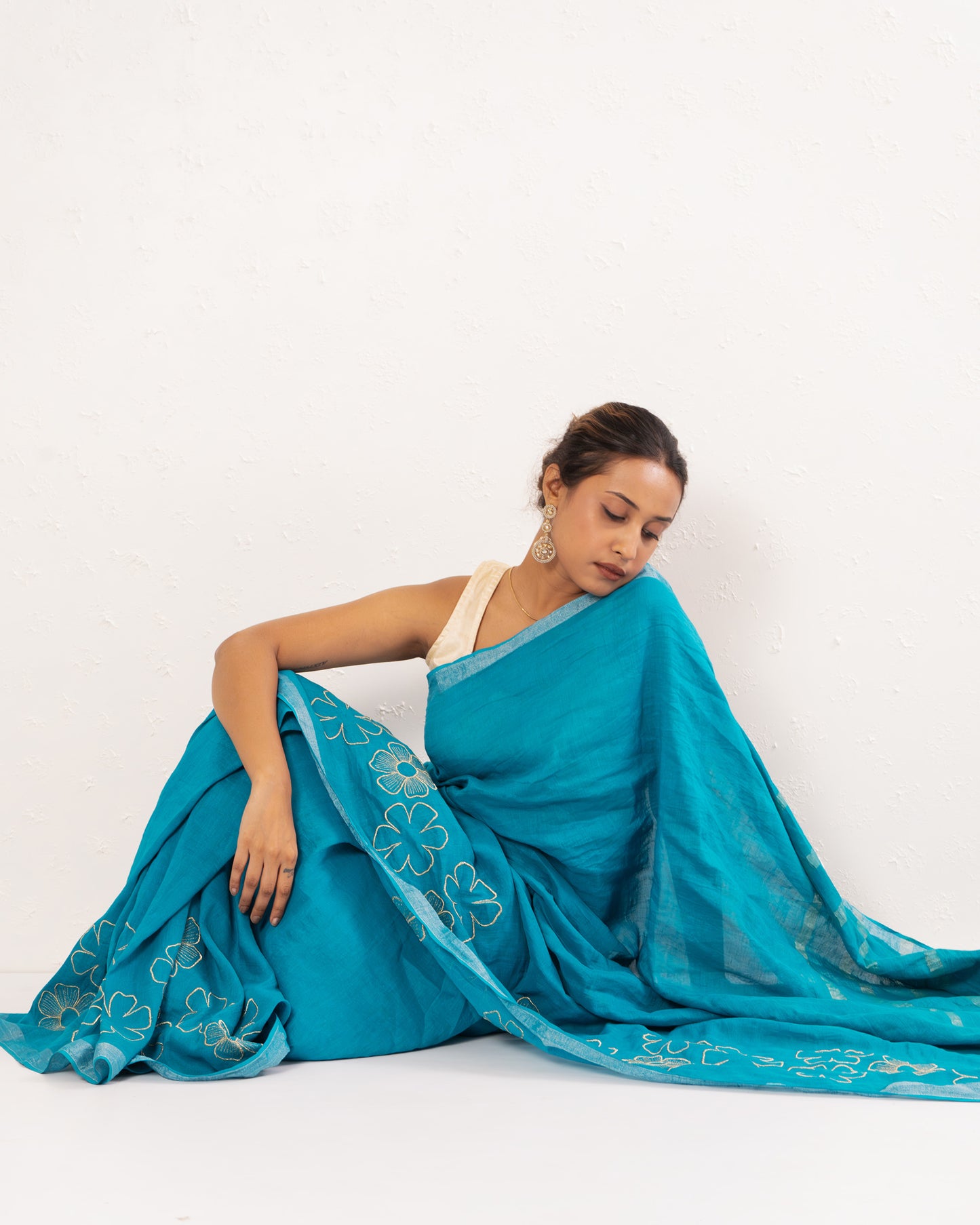 Cyan Blue embroidered handwoven linen saree