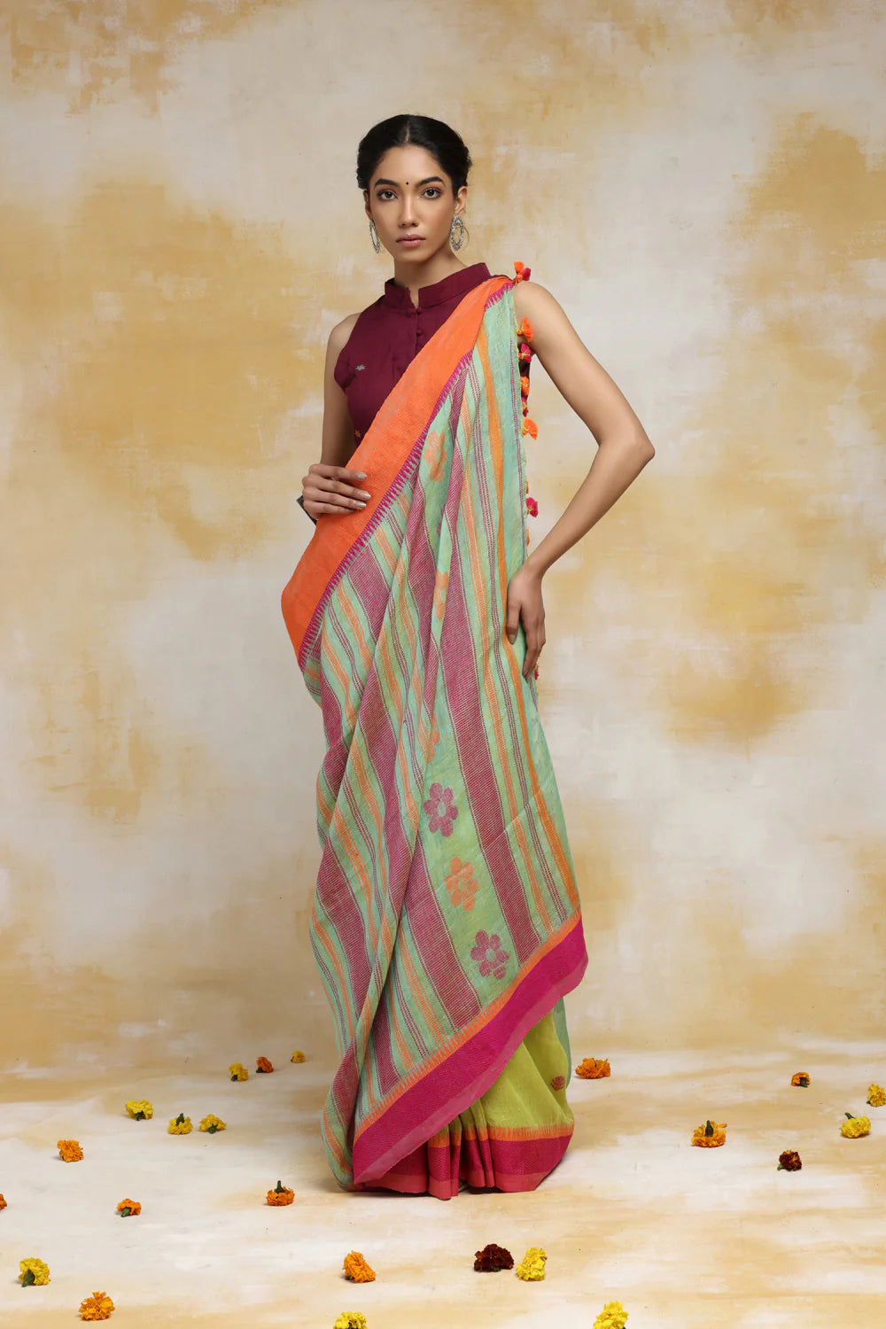 Handloom Mint Green Linen Saree With Pink & Orange Floral Motifs And Tassels