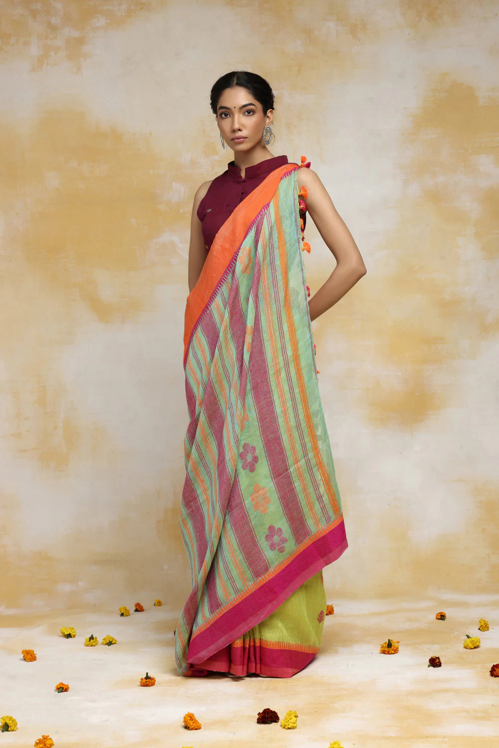 Handloom Mint Green Linen Saree With Pink & Orange Floral Motifs And Tassels