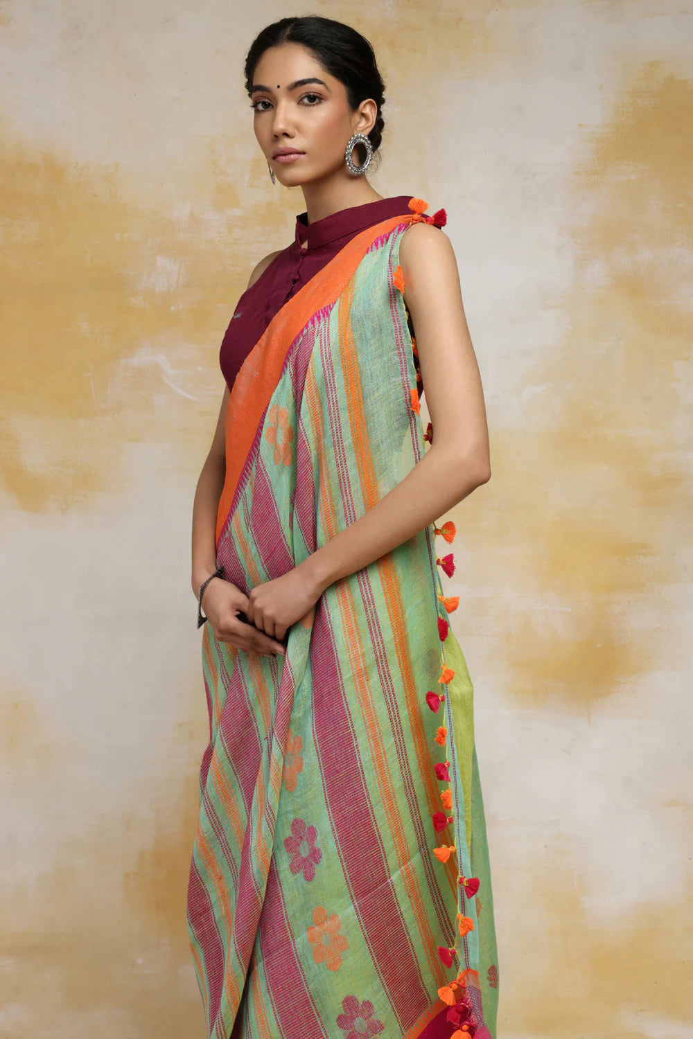 Handloom Mint Green Linen Saree With Pink & Orange Floral Motifs And Tassels