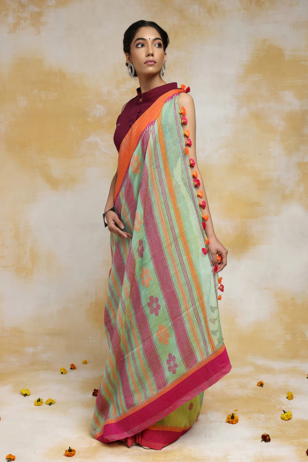 Handloom Mint Green Linen Saree With Pink & Orange Floral Motifs And Tassels