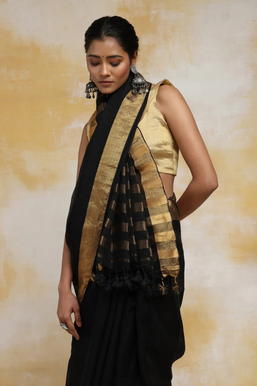 Handloom Black Linen Saree With Gold Zari Border & Zari Stripes In Pallu With Tassels