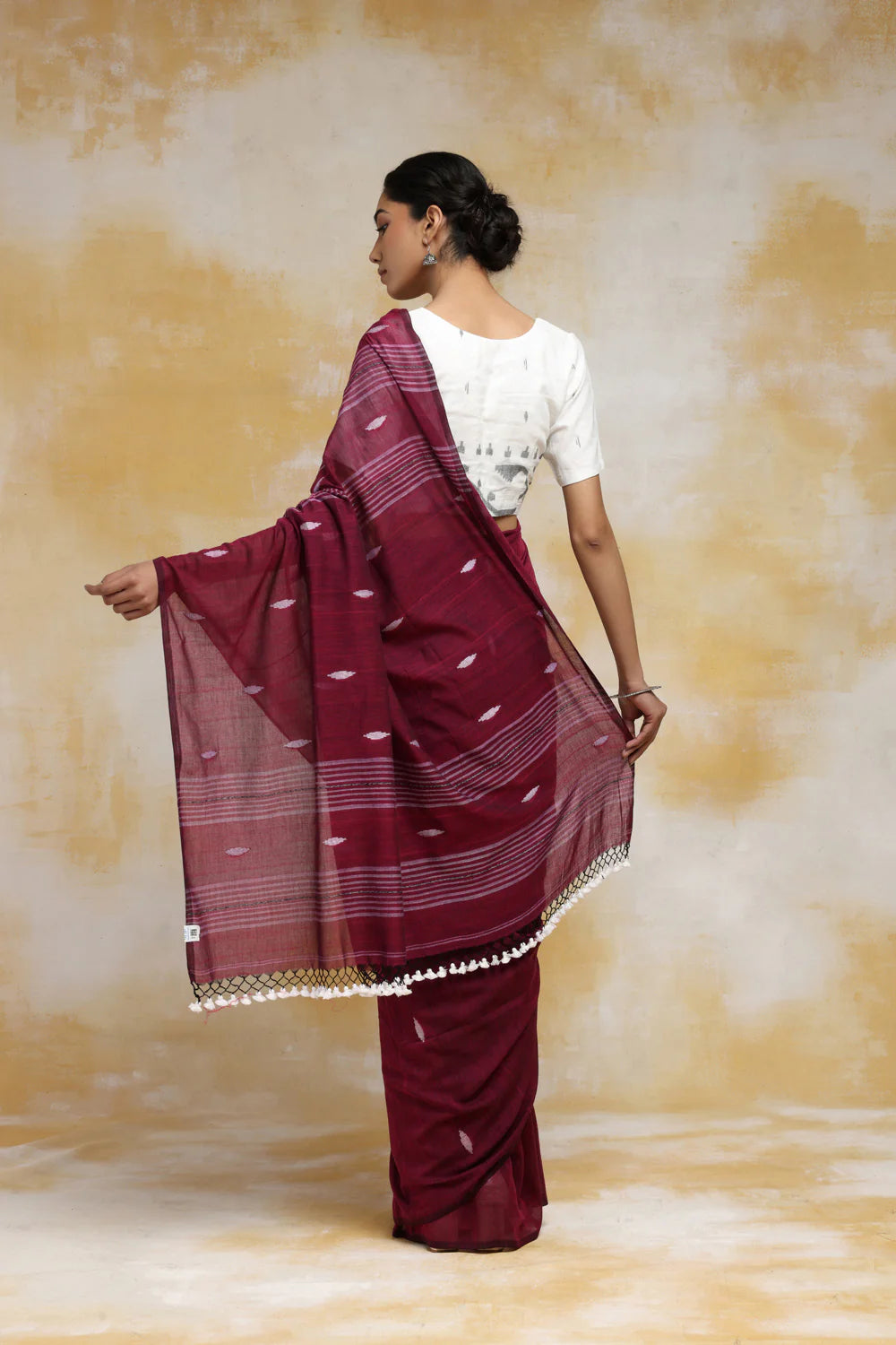 Handloom Wine Mulmul Cotton Saree With White Booti And Tassels