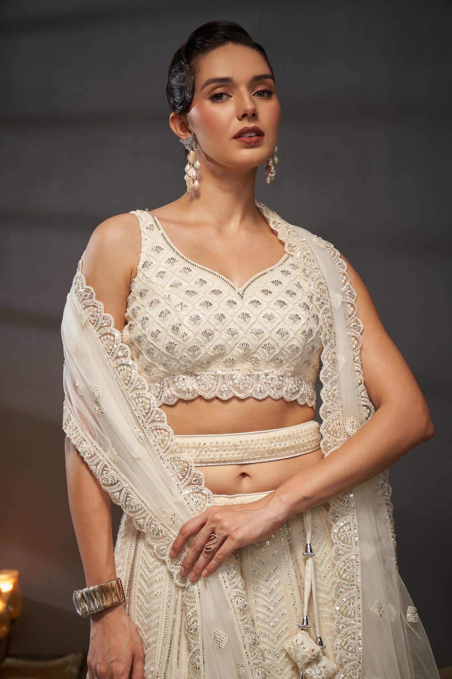 Cream Net Cutdana, Sequins and Zarkan embroidery Lehenga