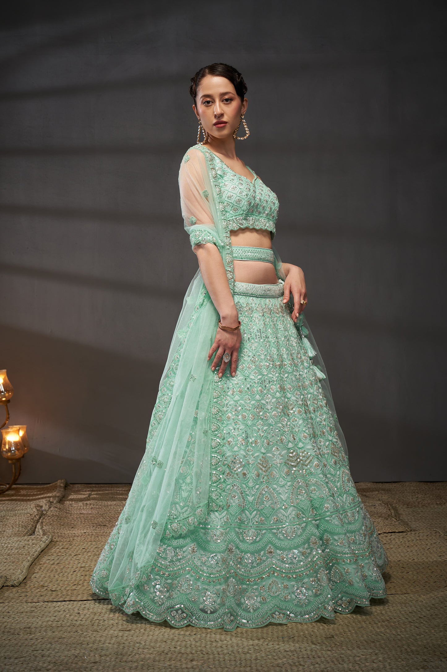 Turquoise blue Net Cutdana, Sequins and Zarkan embroidery Lehenga