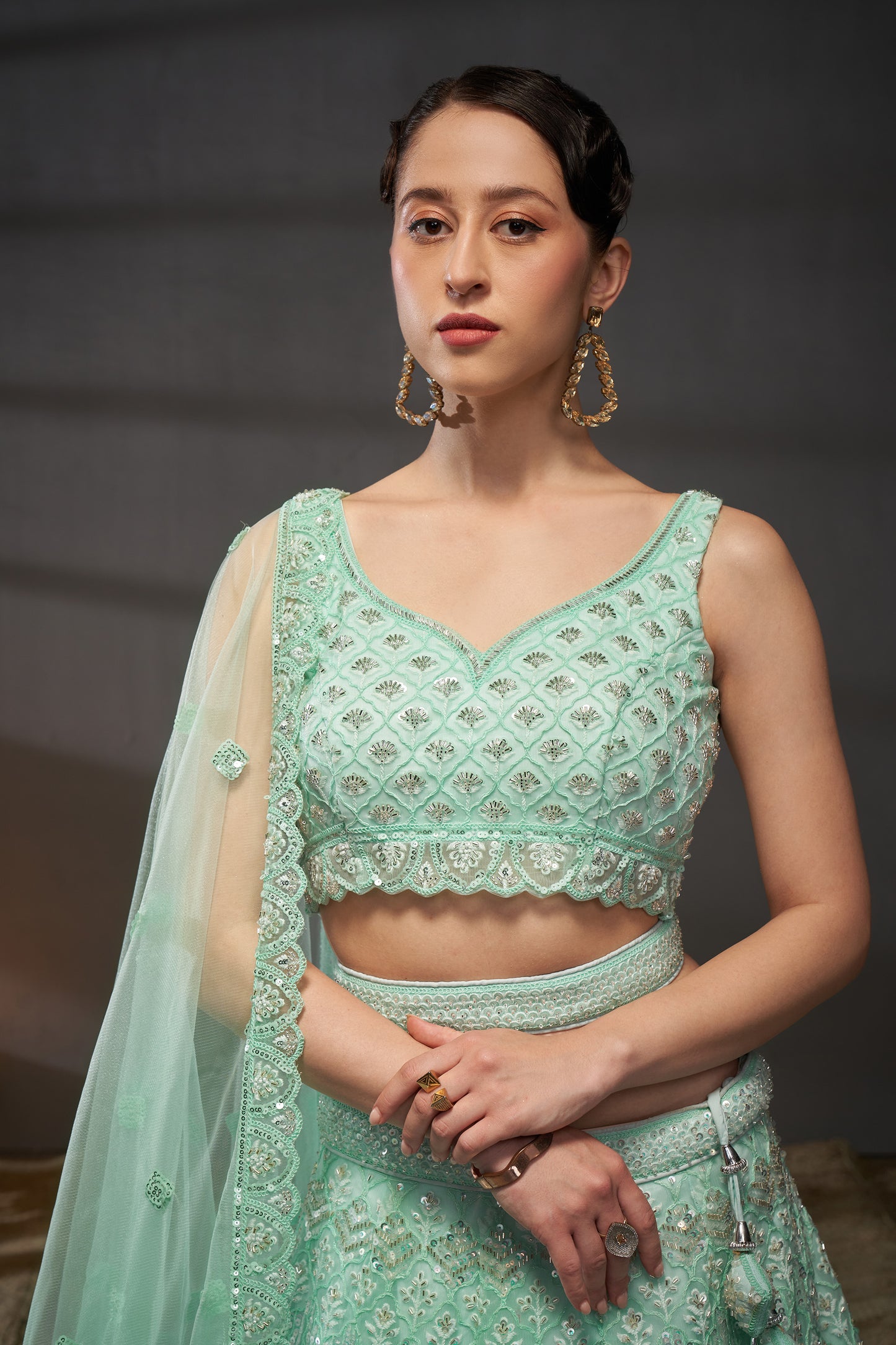 Turquoise blue Net Cutdana, Sequins and Zarkan embroidery Lehenga