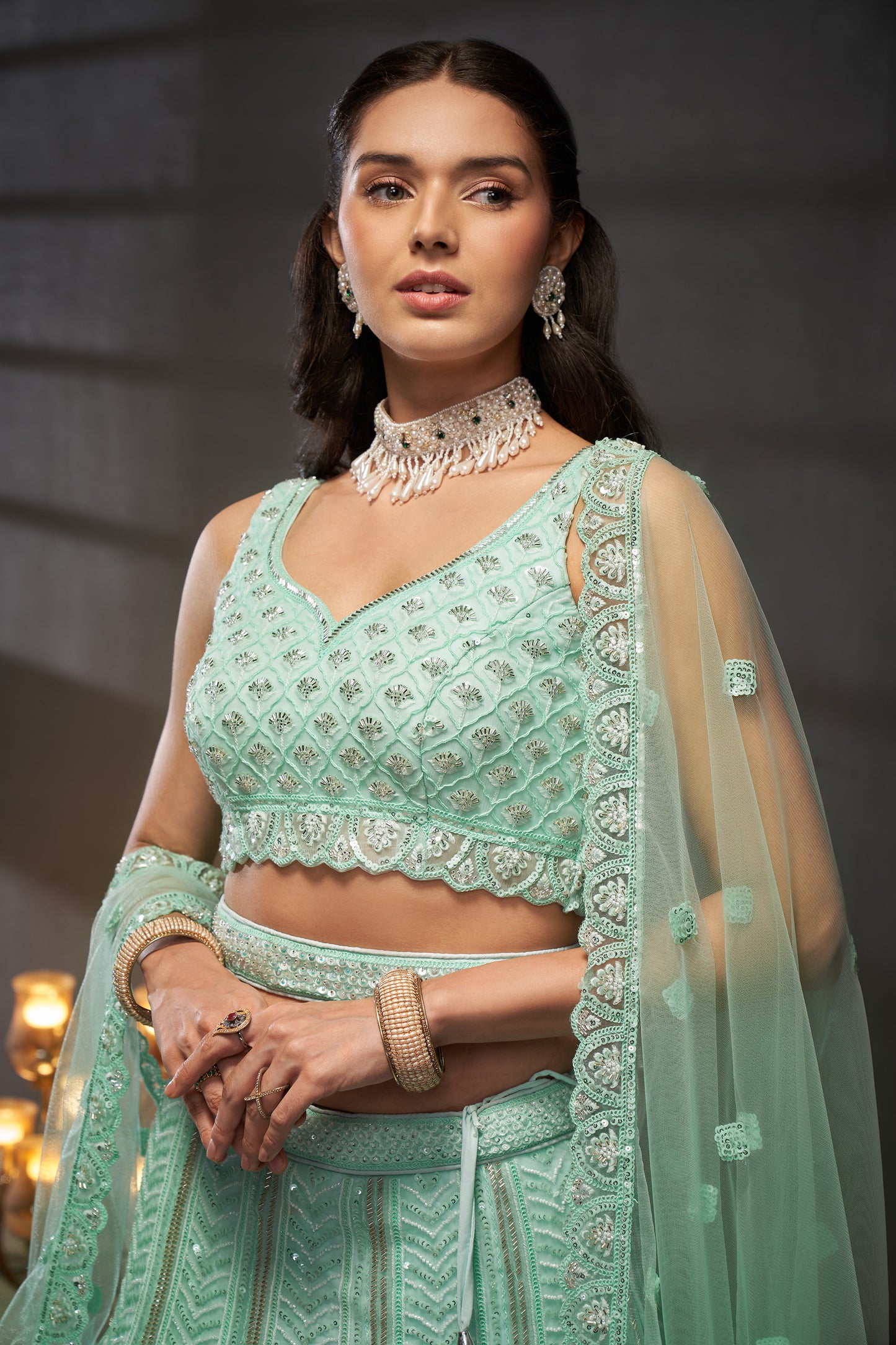 Turquoise blue Net Cutdana, Sequins and Zarkan embroidery Lehenga