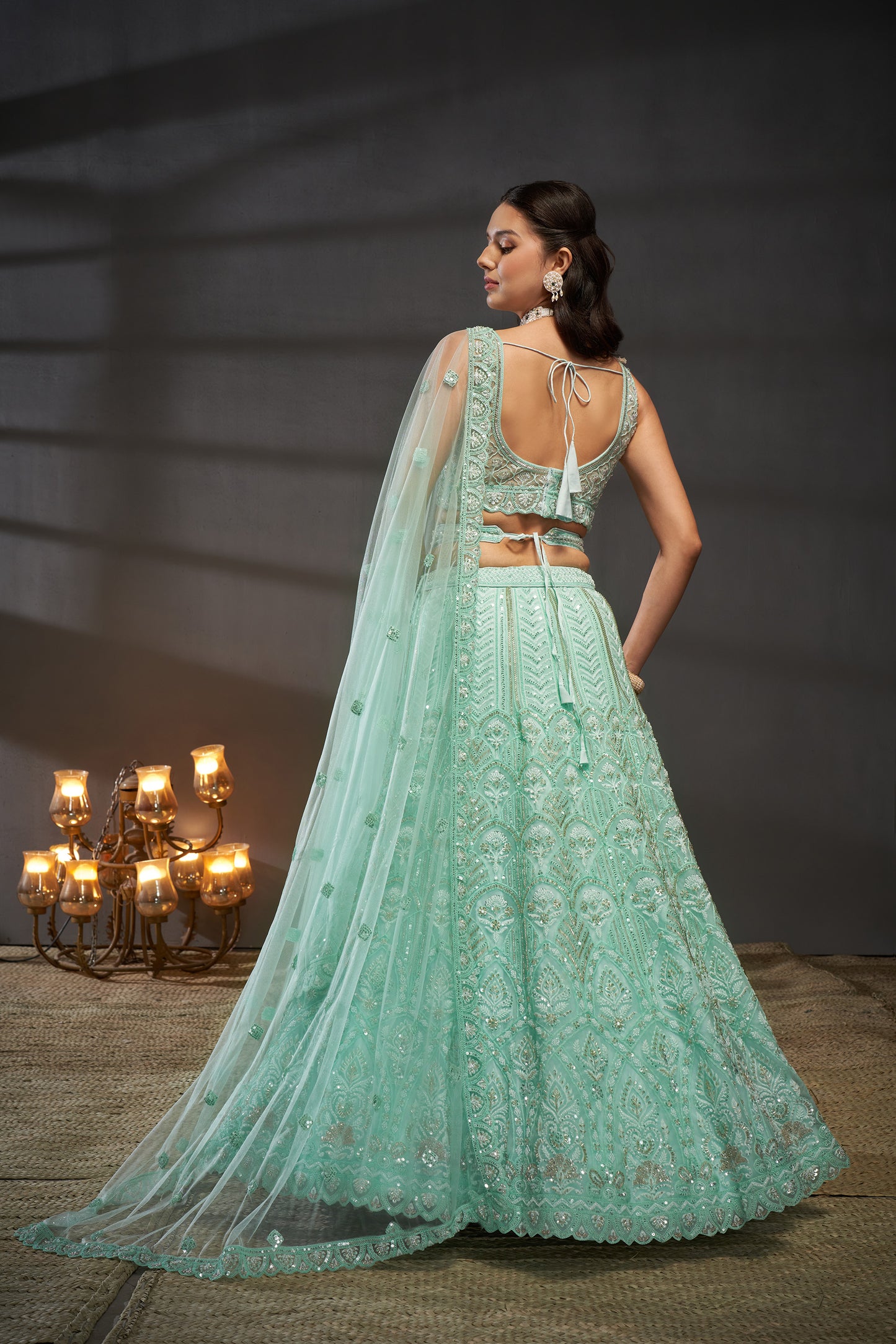 Turquoise blue Net Cutdana, Sequins and Zarkan embroidery Lehenga