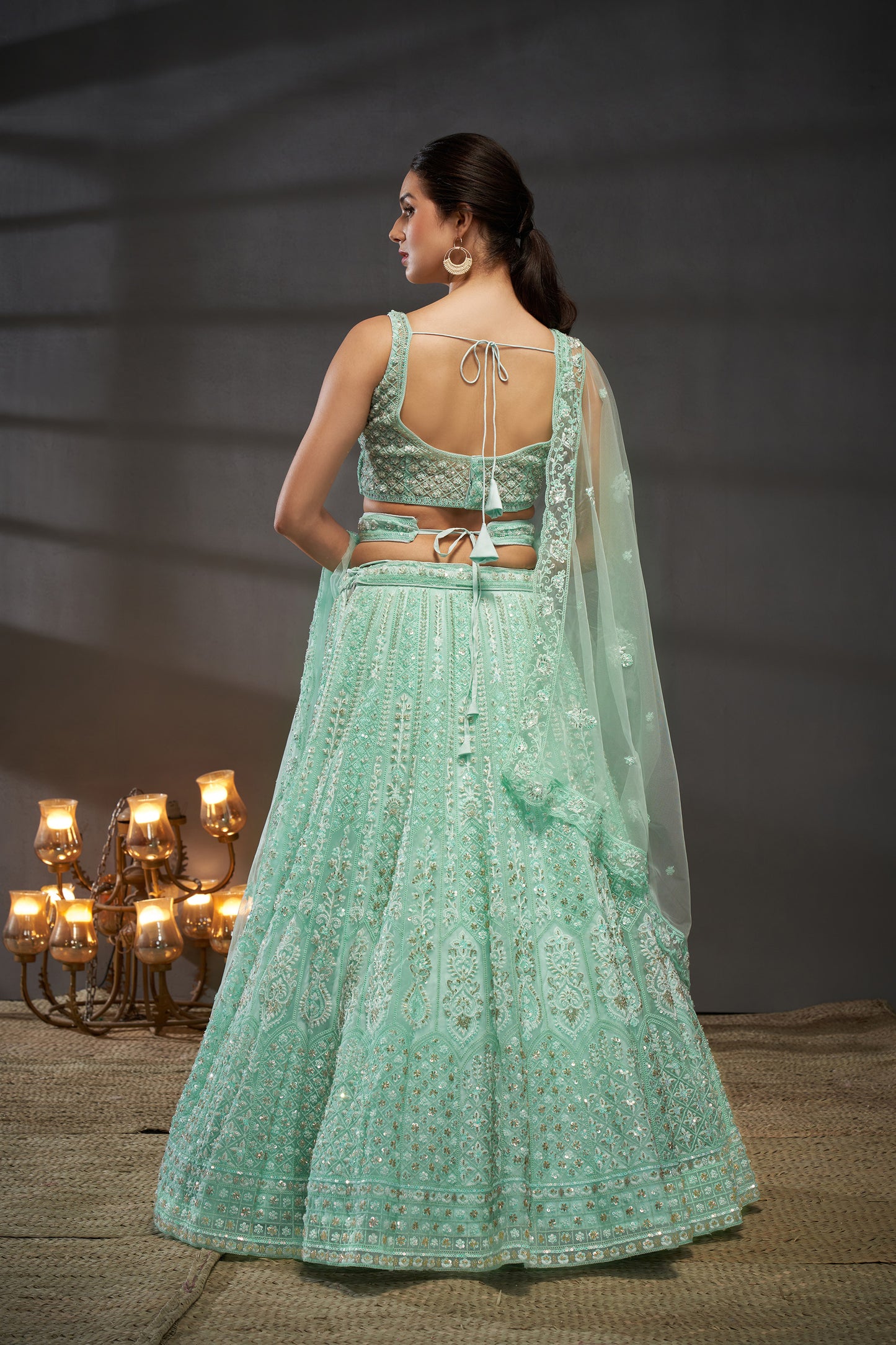 Turquoise blue Net Cutdana, Sequins and Zarkan embroidery Lehenga