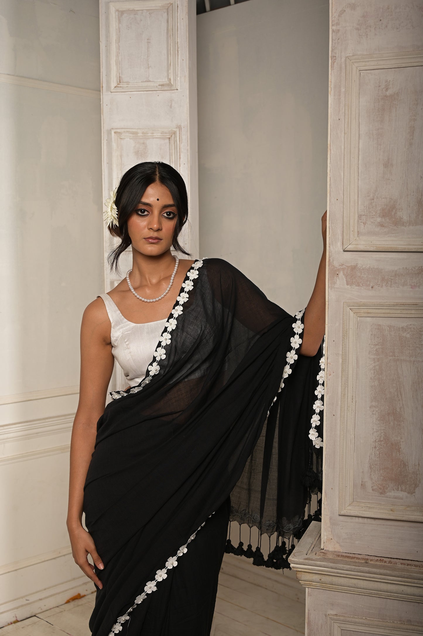 Nishi Raat | Black cotton saree with stitched lace floral embroidered border