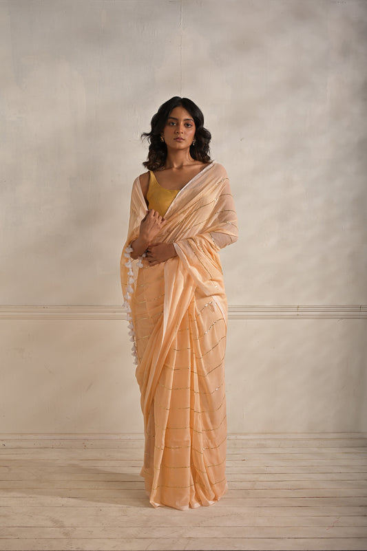 Roshni | Peach handloom mul cotton saree with sequined lines