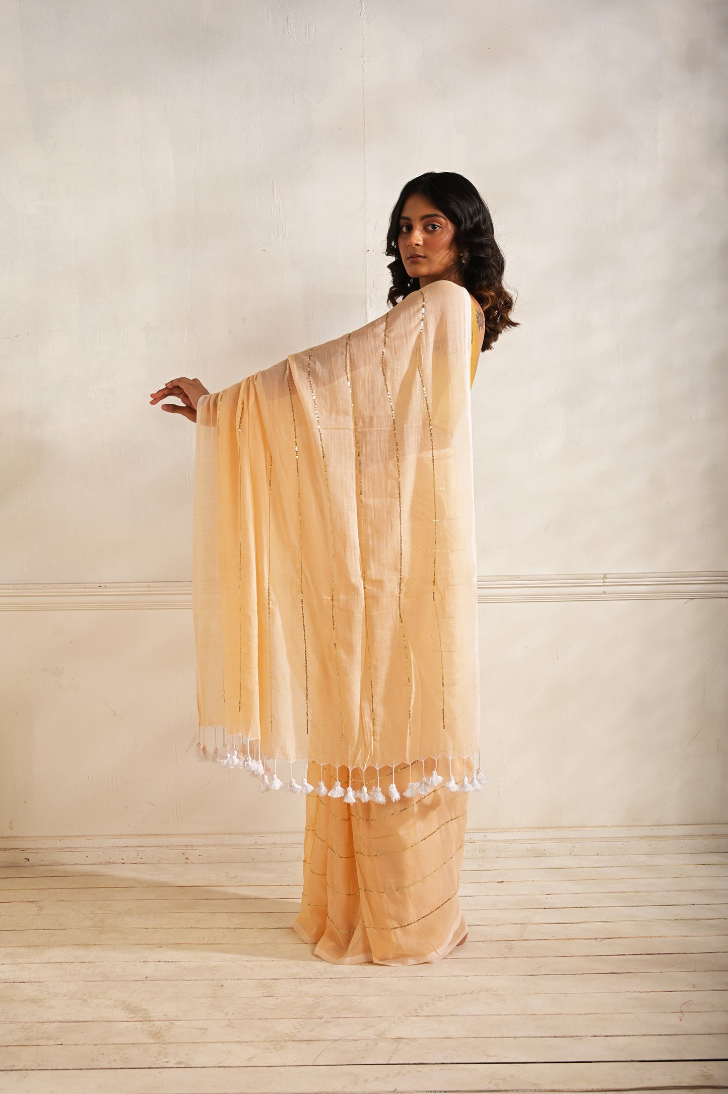 Roshni | Peach handloom mul cotton saree with sequined lines