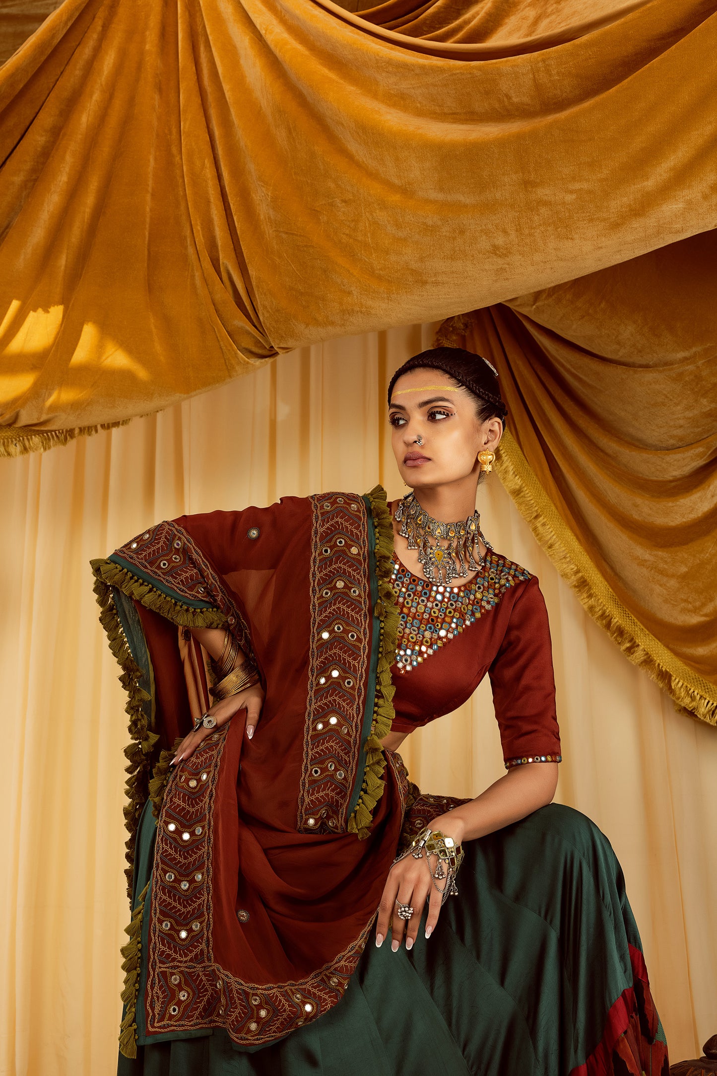 Teal lehenga with rust choli & hand embroidered dupatta