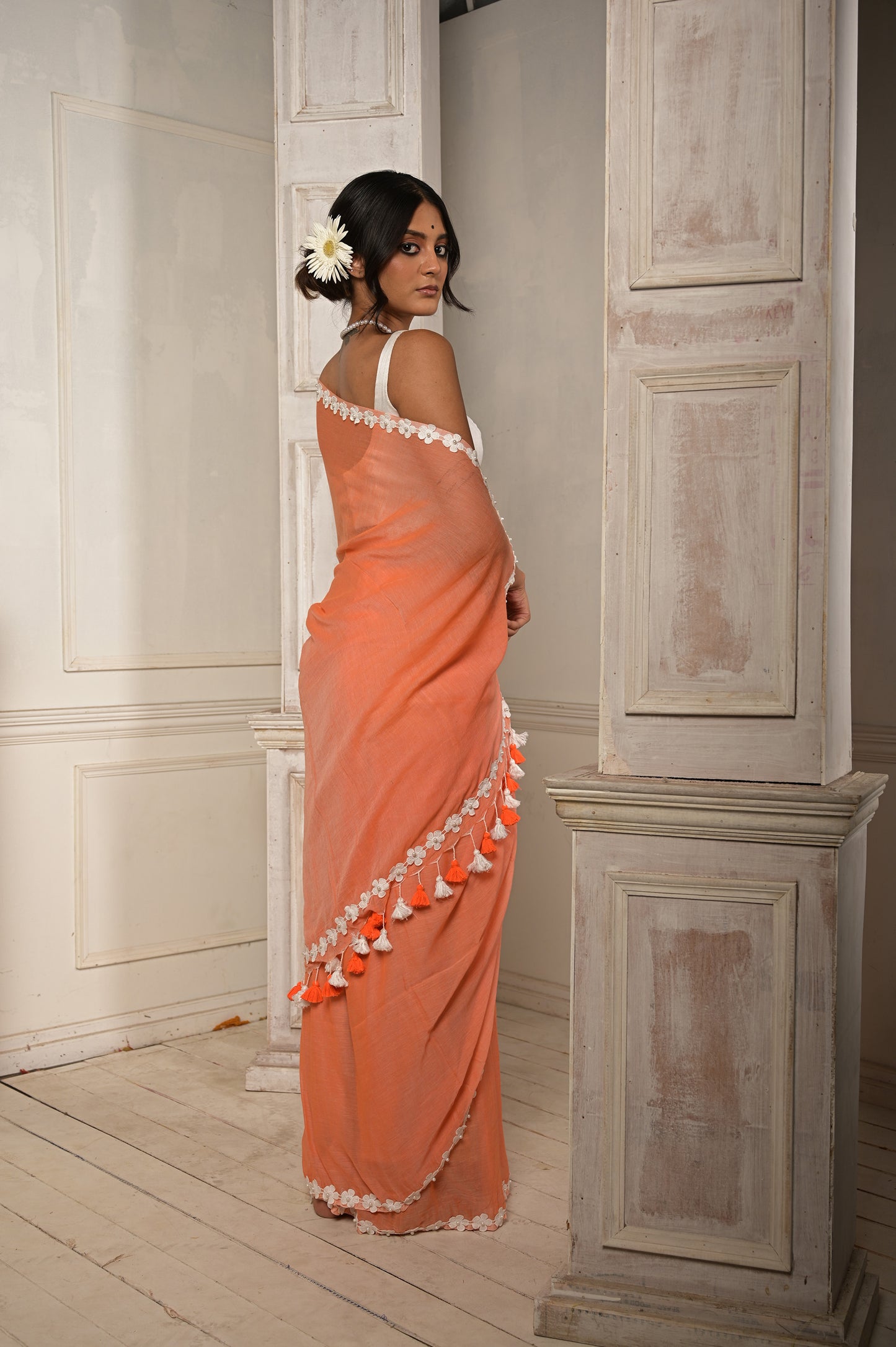 Surbhi shaam | Peach Pink cotton saree with stitched lace floral embroidered border