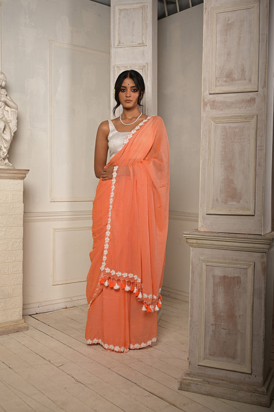 Surbhi shaam | Peach Pink cotton saree with stitched lace floral embroidered border