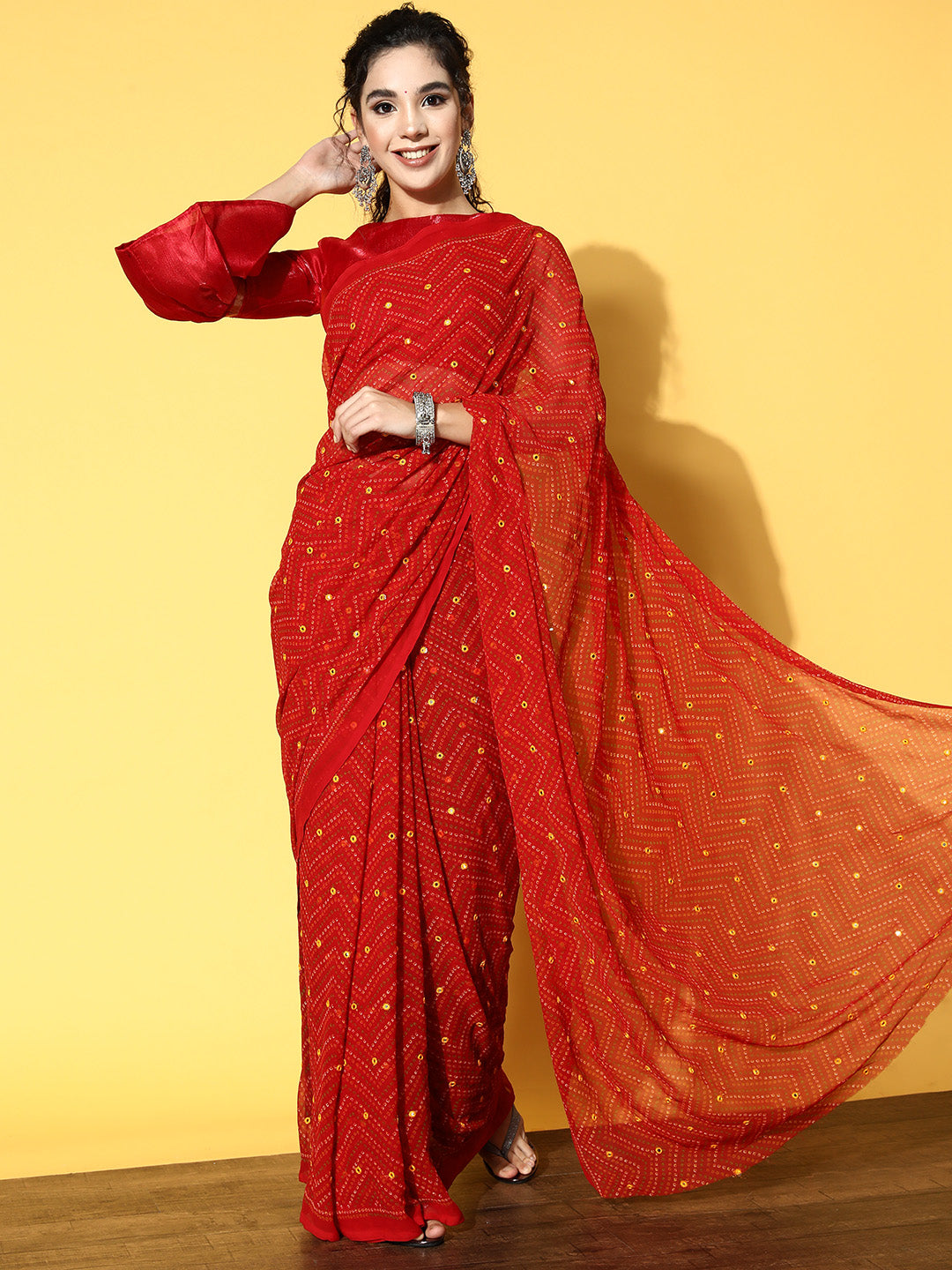 Red colored Bandhani polyester georgette saree with mirror work