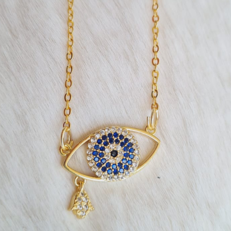 This handcrafted crystal evil eye necklace offers both style and protection. The intricate design and use of high-quality crystals make it a unique and eye-catching