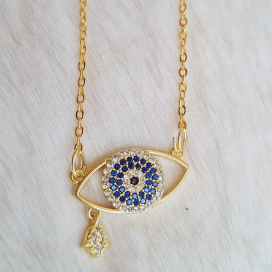 This handcrafted crystal evil eye necklace offers both style and protection. The intricate design and use of high-quality crystals make it a unique and eye-catching