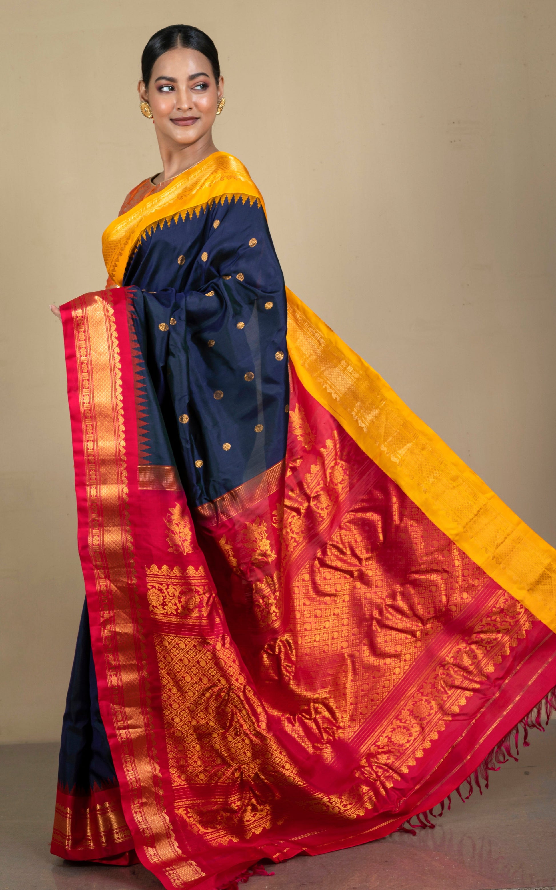 Exclusive Gadwal Silk Saree in Ink Blue, Saffron Yellow, Bright Red and Golden Zari Weave