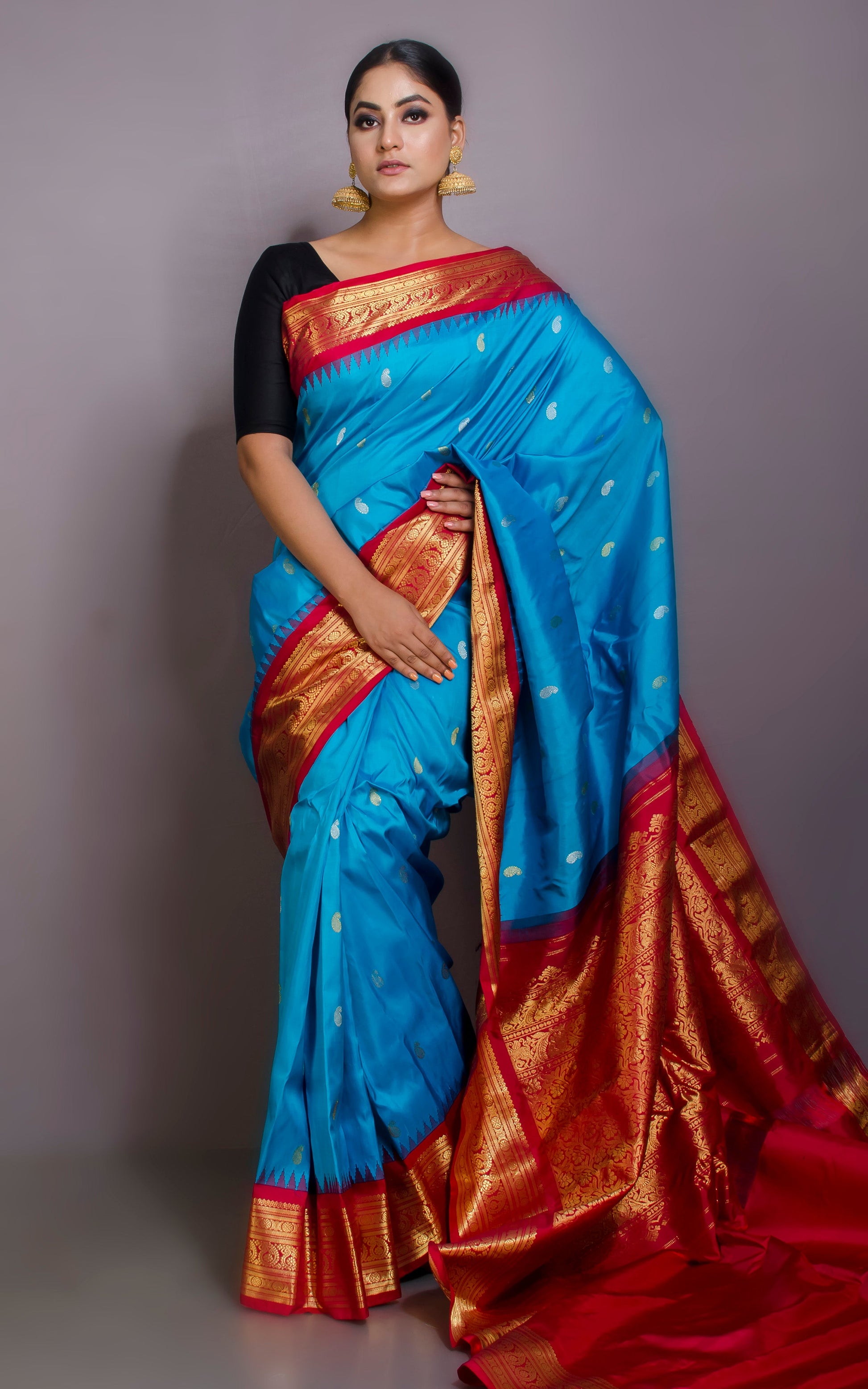 Exclusive Gadwal Silk Saree in Maya Blue,Twill Rani Pink and Golden Zari Work