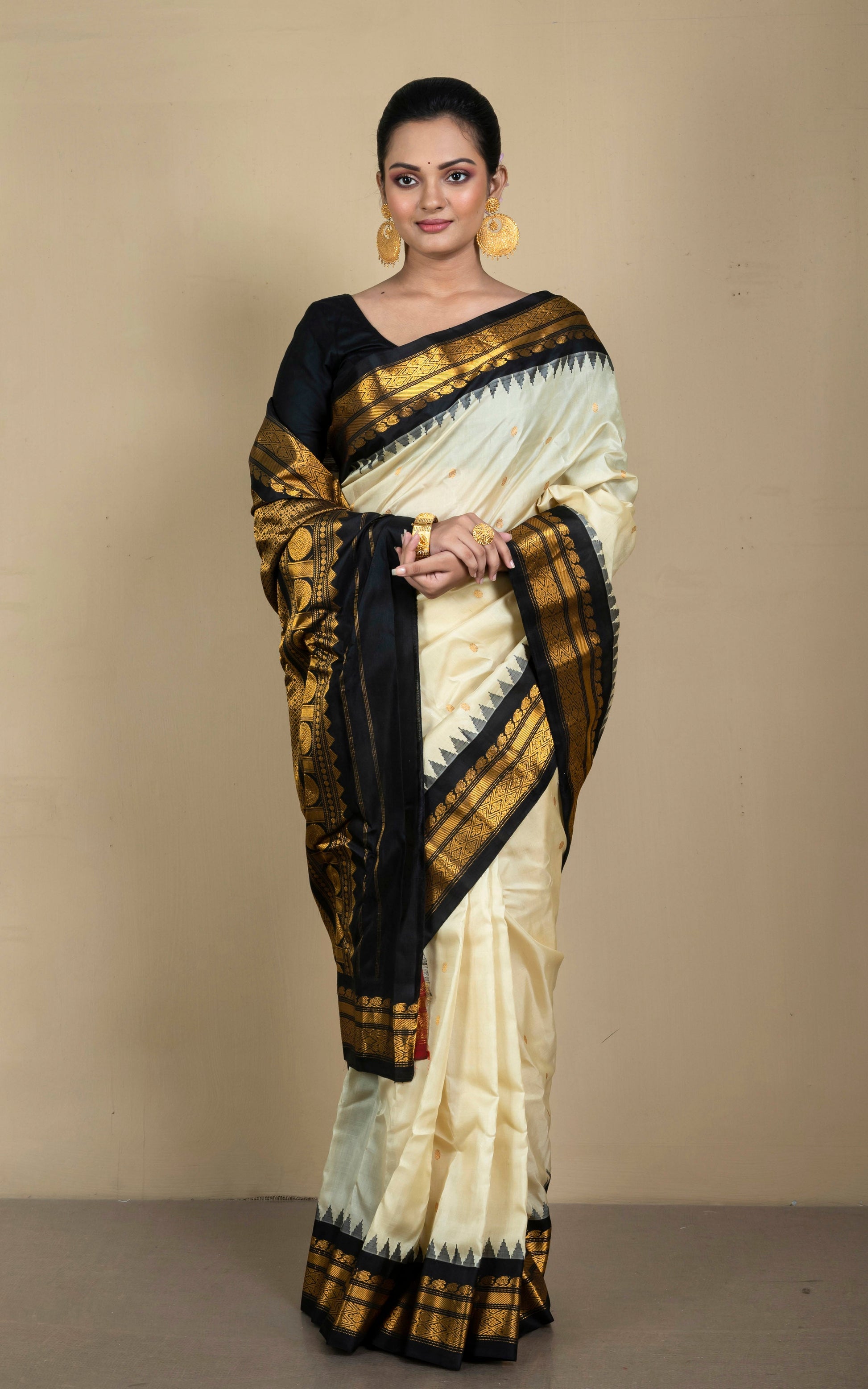 Handwoven Exclusive Gadwal Silk Saree in Off White, Zed Black and Golden Zari Work