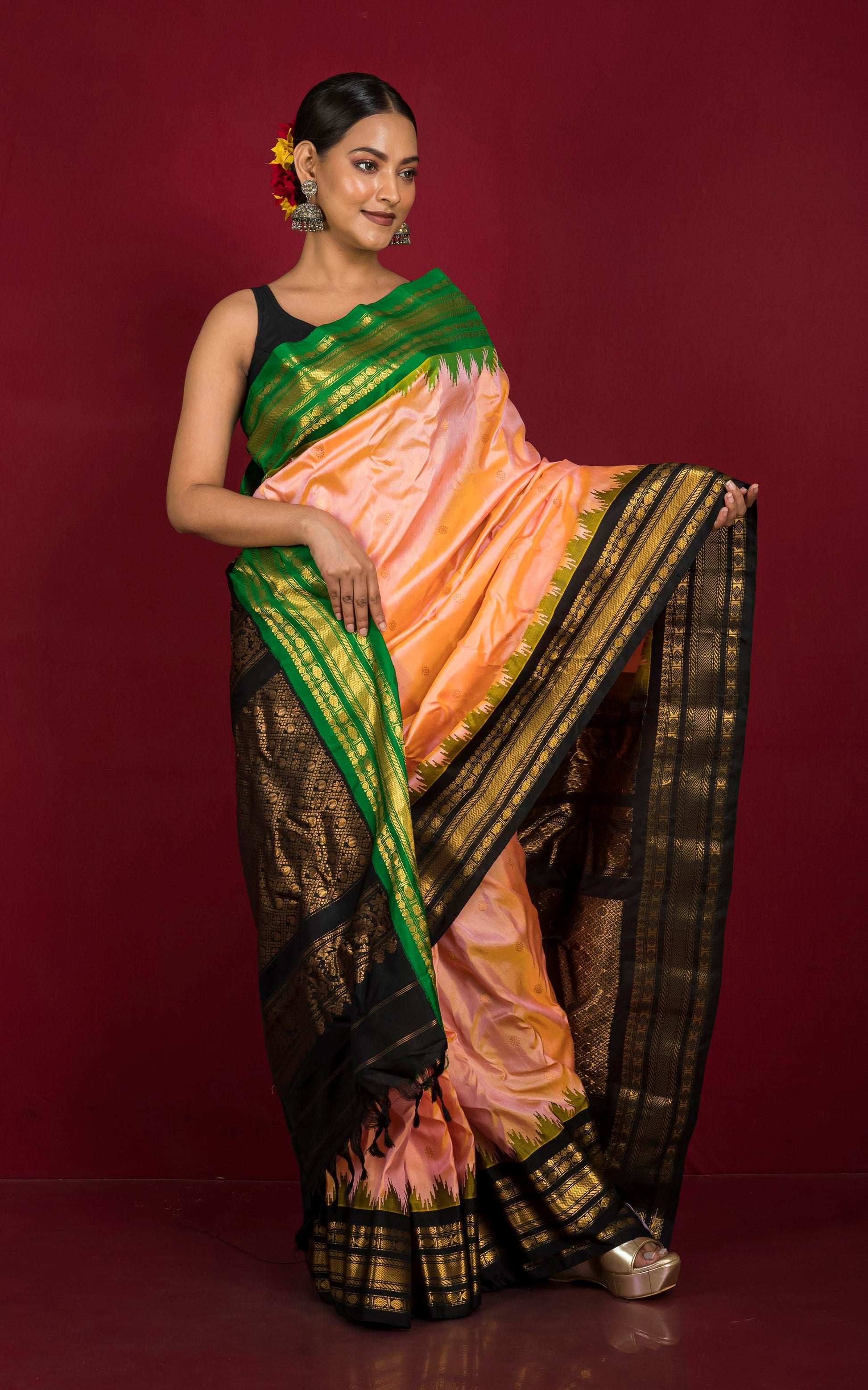 Handwoven Exclusive Gadwal Silk Saree in Peach, Bright Green, Black and Golden Zari Work