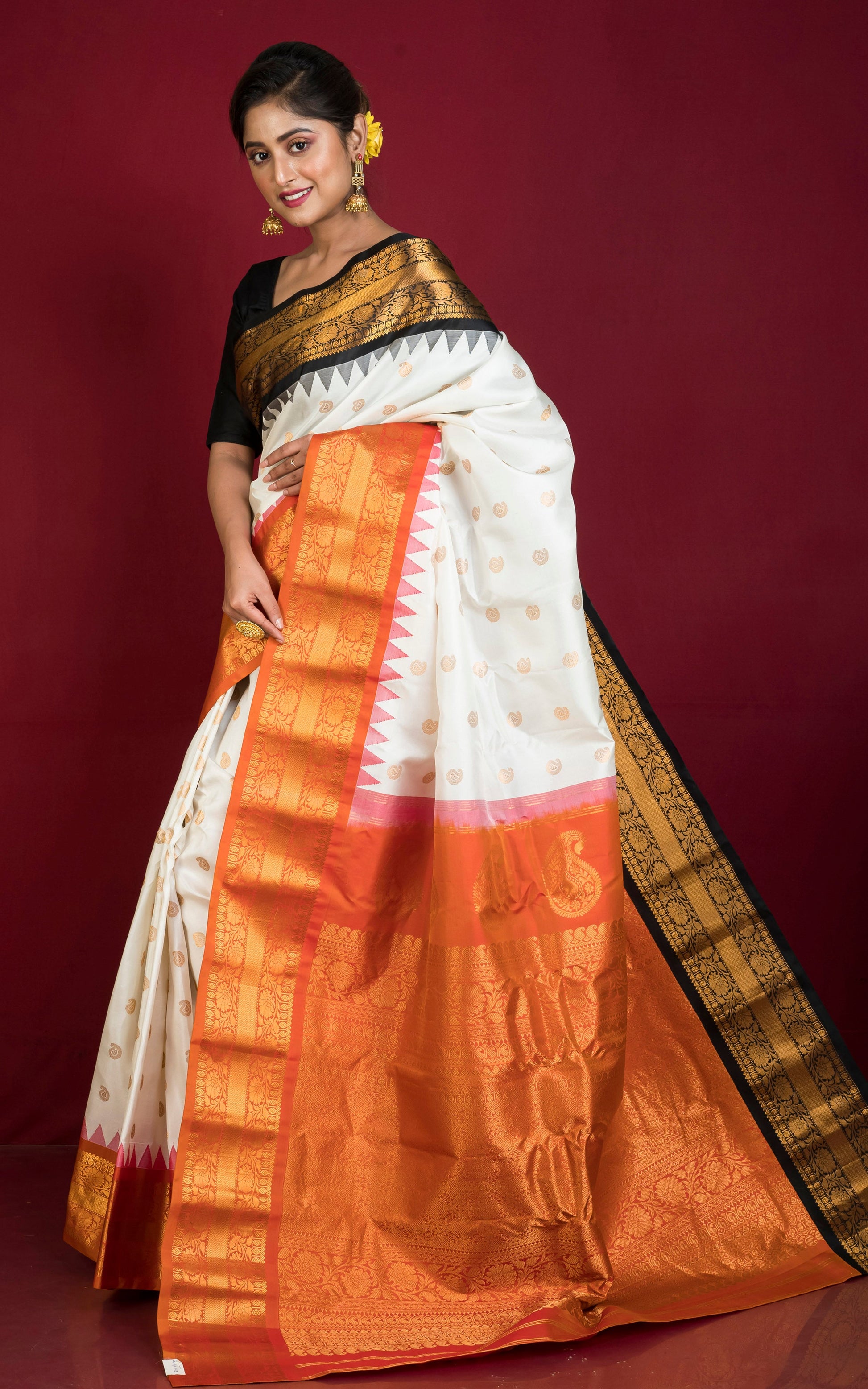 Exclusive Gadwal Silk Saree in Off White, Black, Burnt Orange and Golden Zari Weave