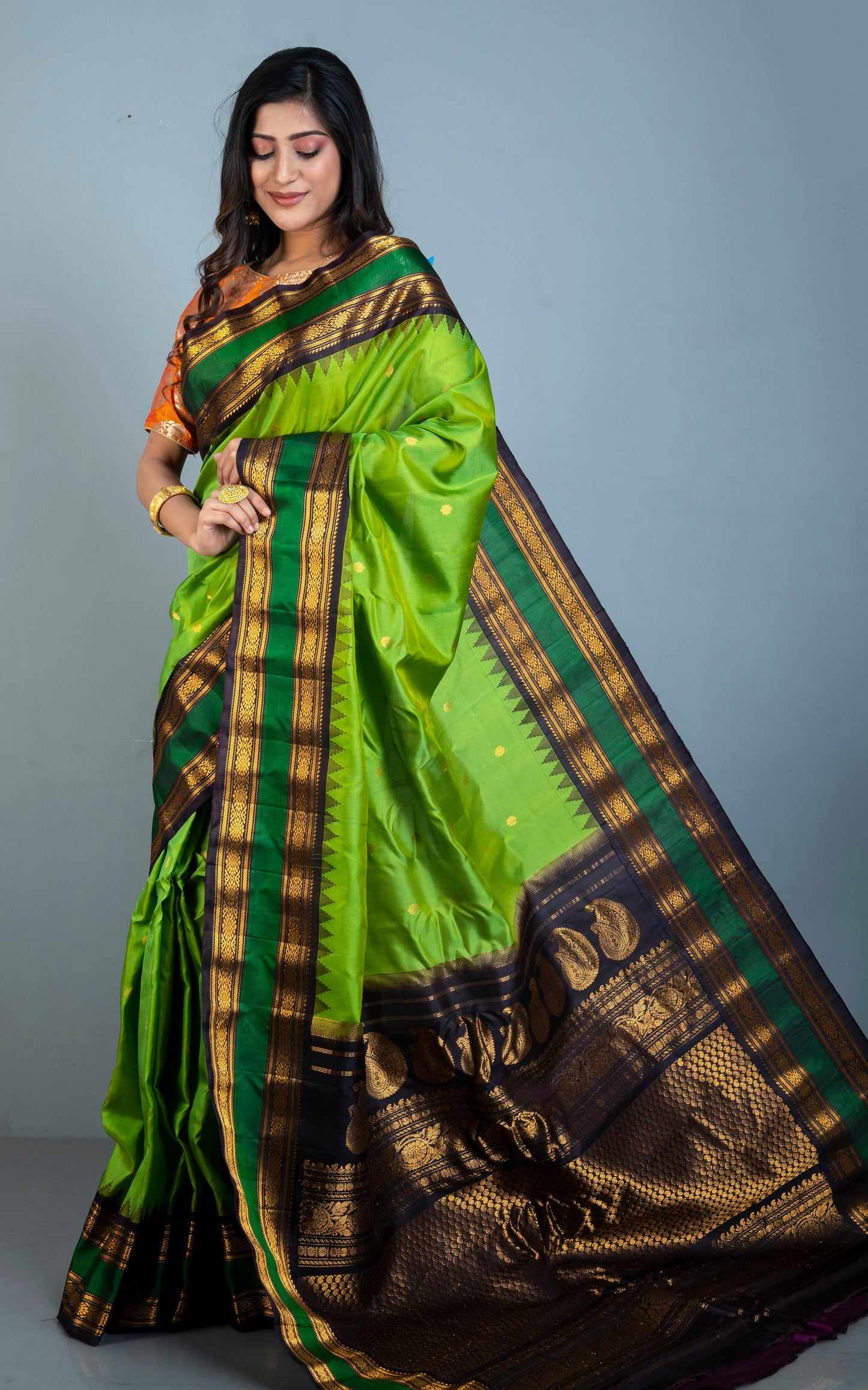 Handwoven Metro Temple Border Gadwal Silk Saree in Kelly Green, Black and Golden Zari Work