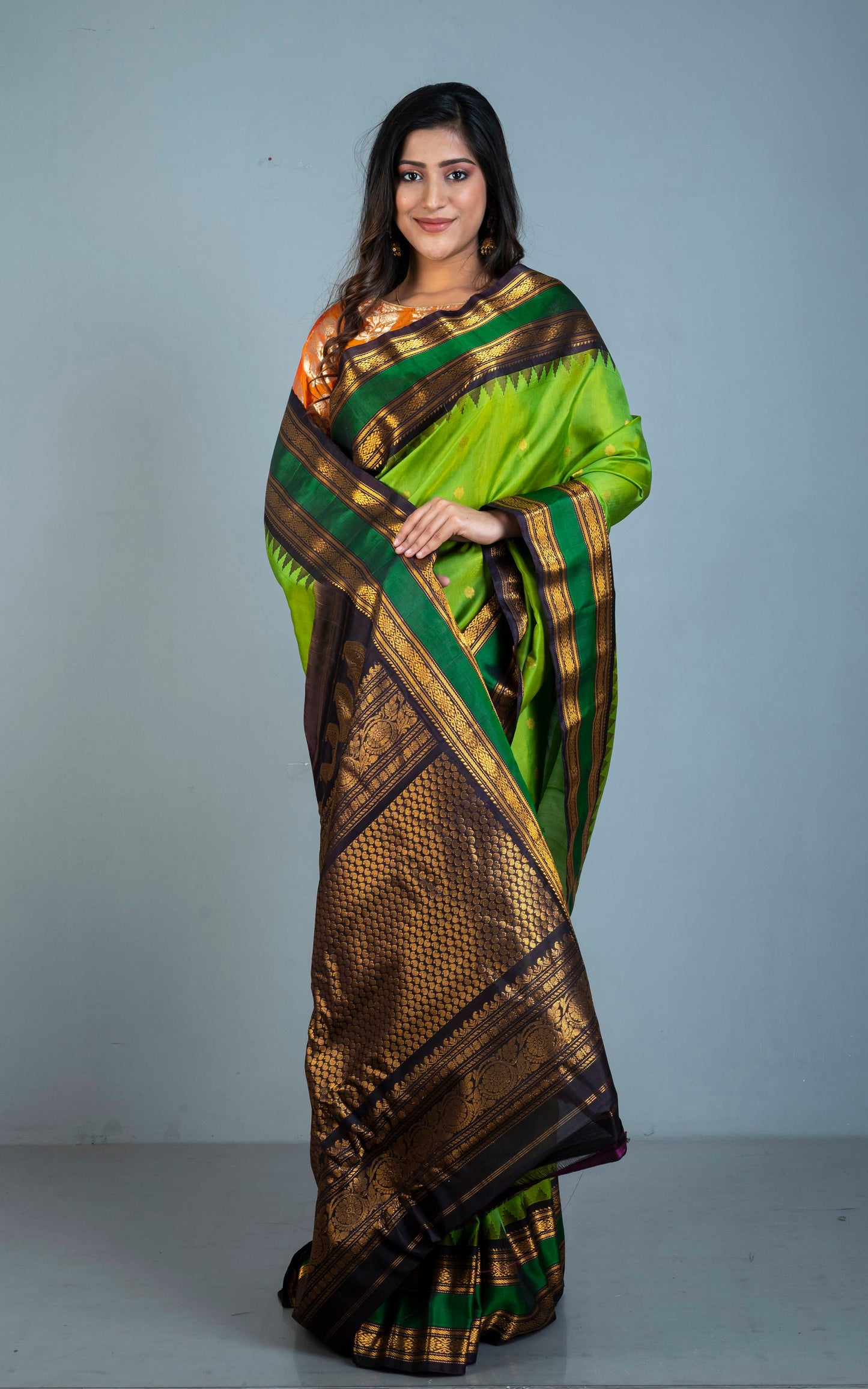 Handwoven Metro Temple Border Gadwal Silk Saree in Kelly Green, Black and Golden Zari Work