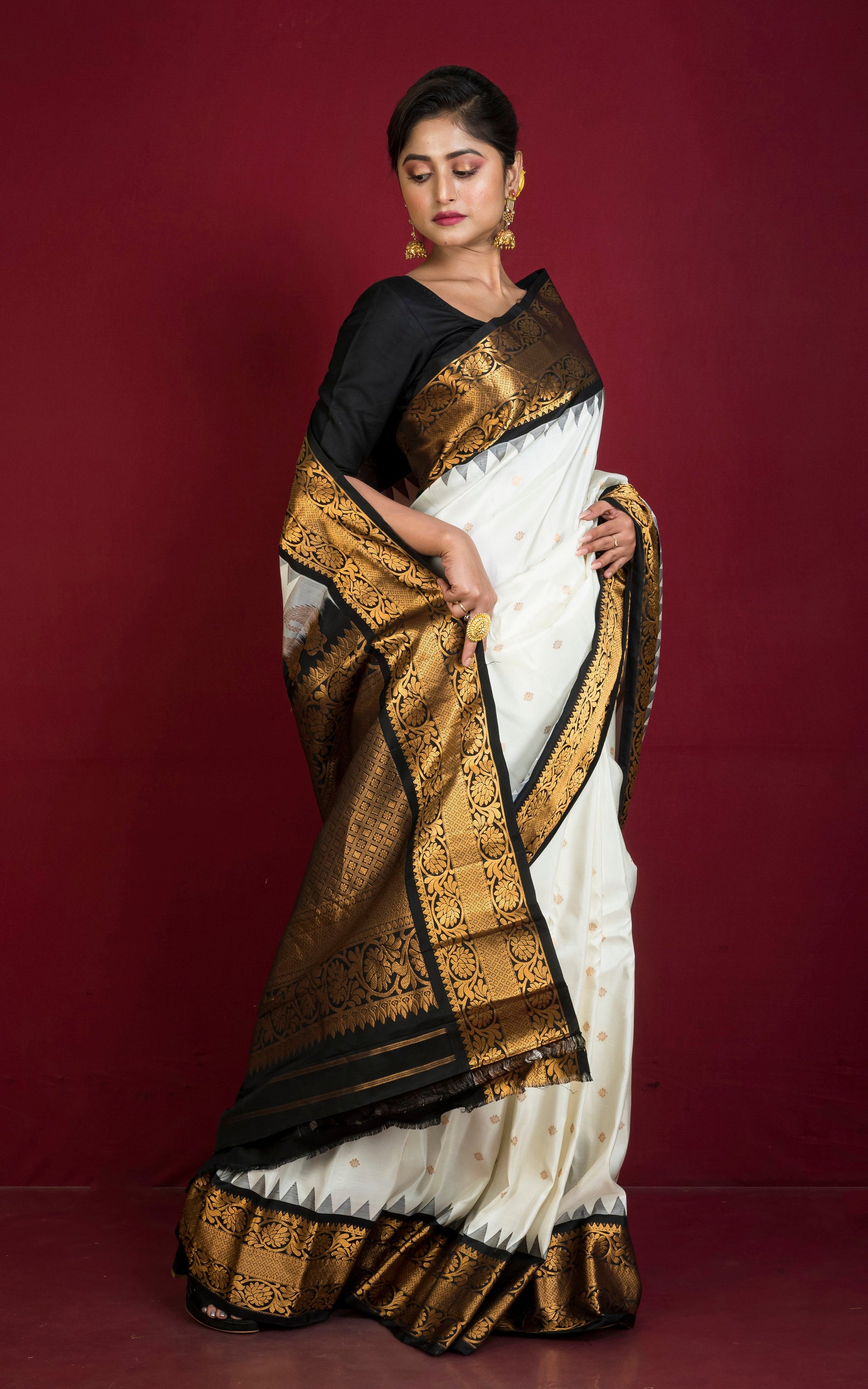 Handwoven Exclusive Gadwal Silk Saree in Off White, Black and Golden Zari Work