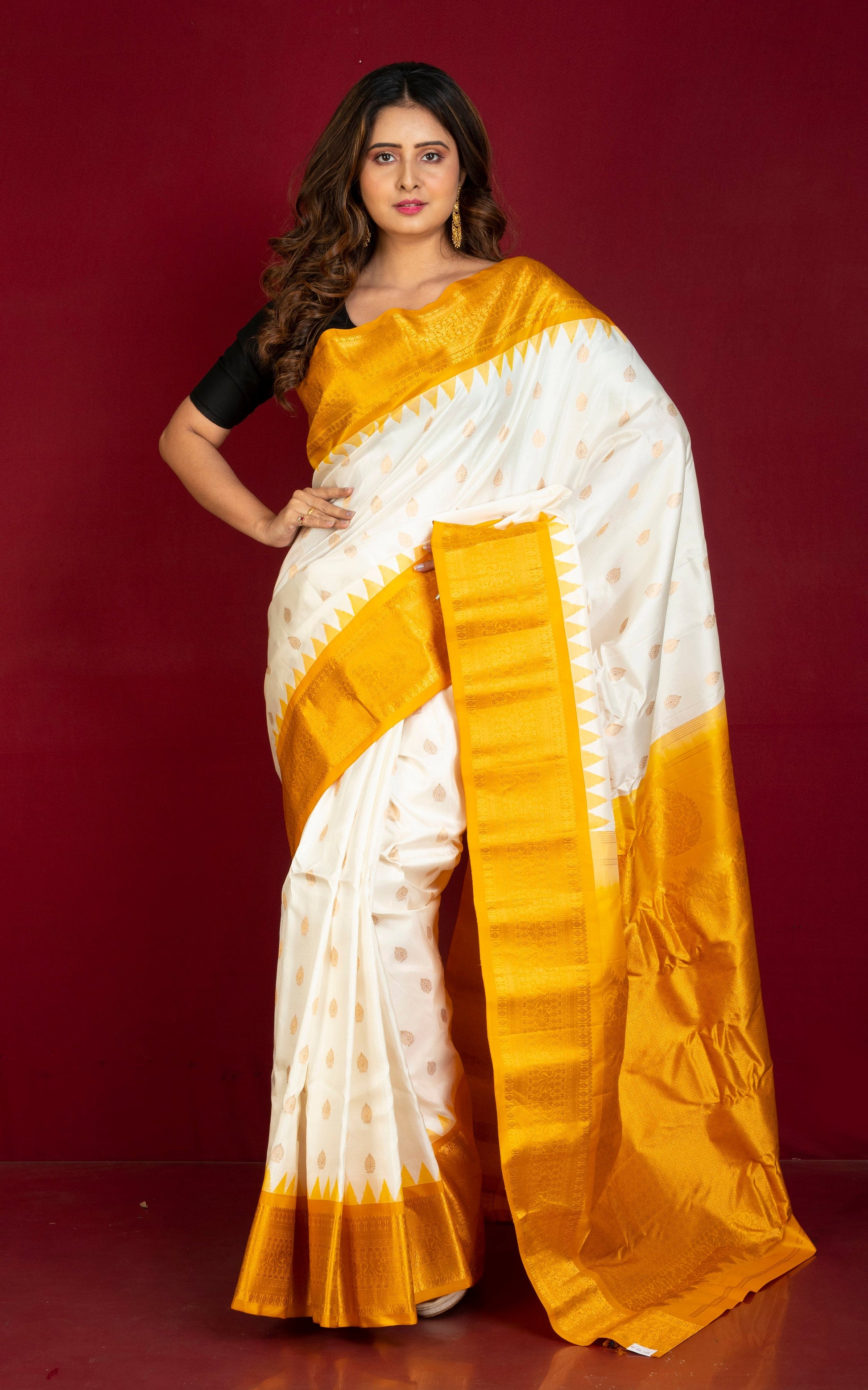 Handwoven Exclusive Gadwal Silk Saree in Off White, Mustard Golden and Golden Zari Work