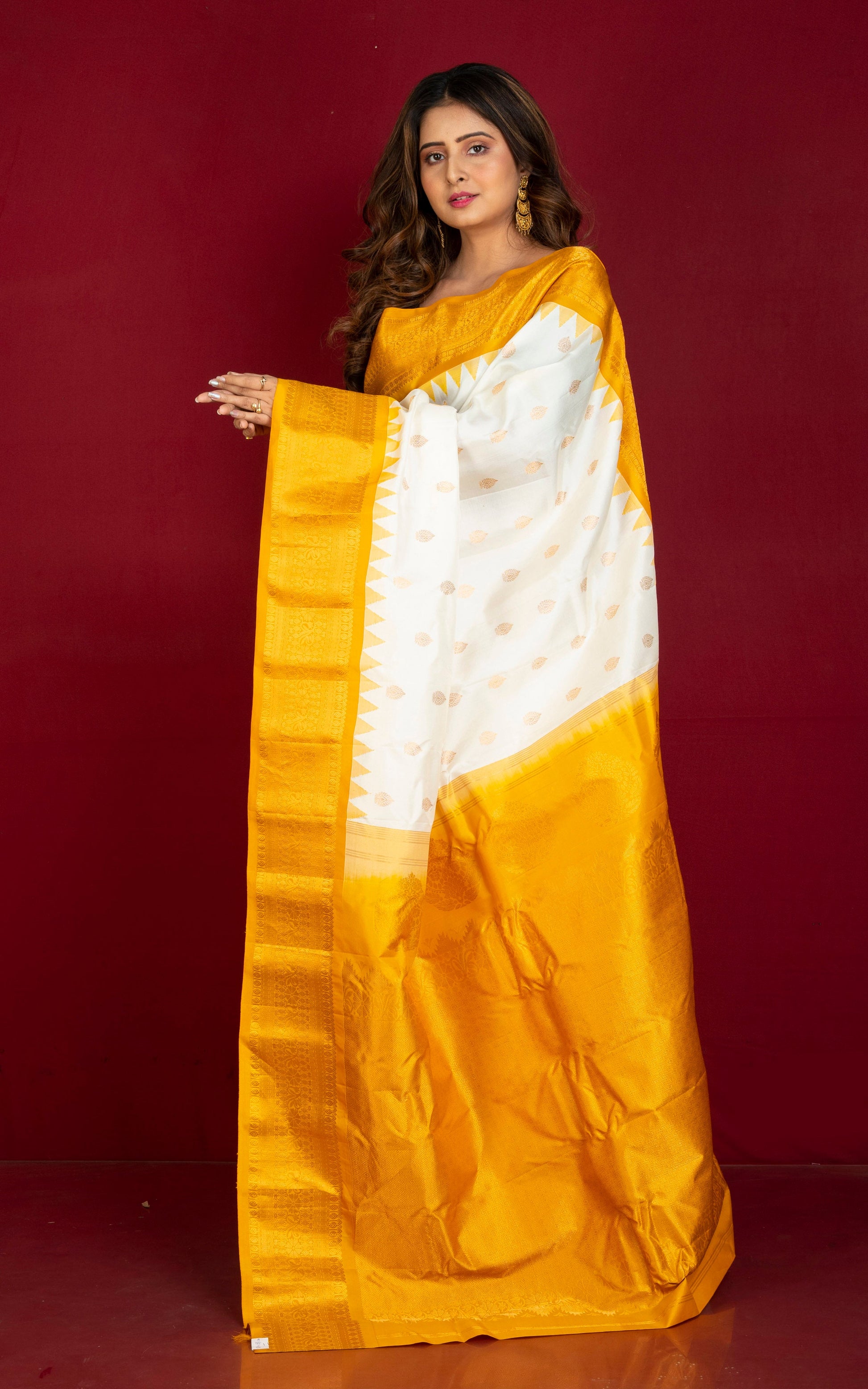 Handwoven Exclusive Gadwal Silk Saree in Off White, Mustard Golden and Golden Zari Work