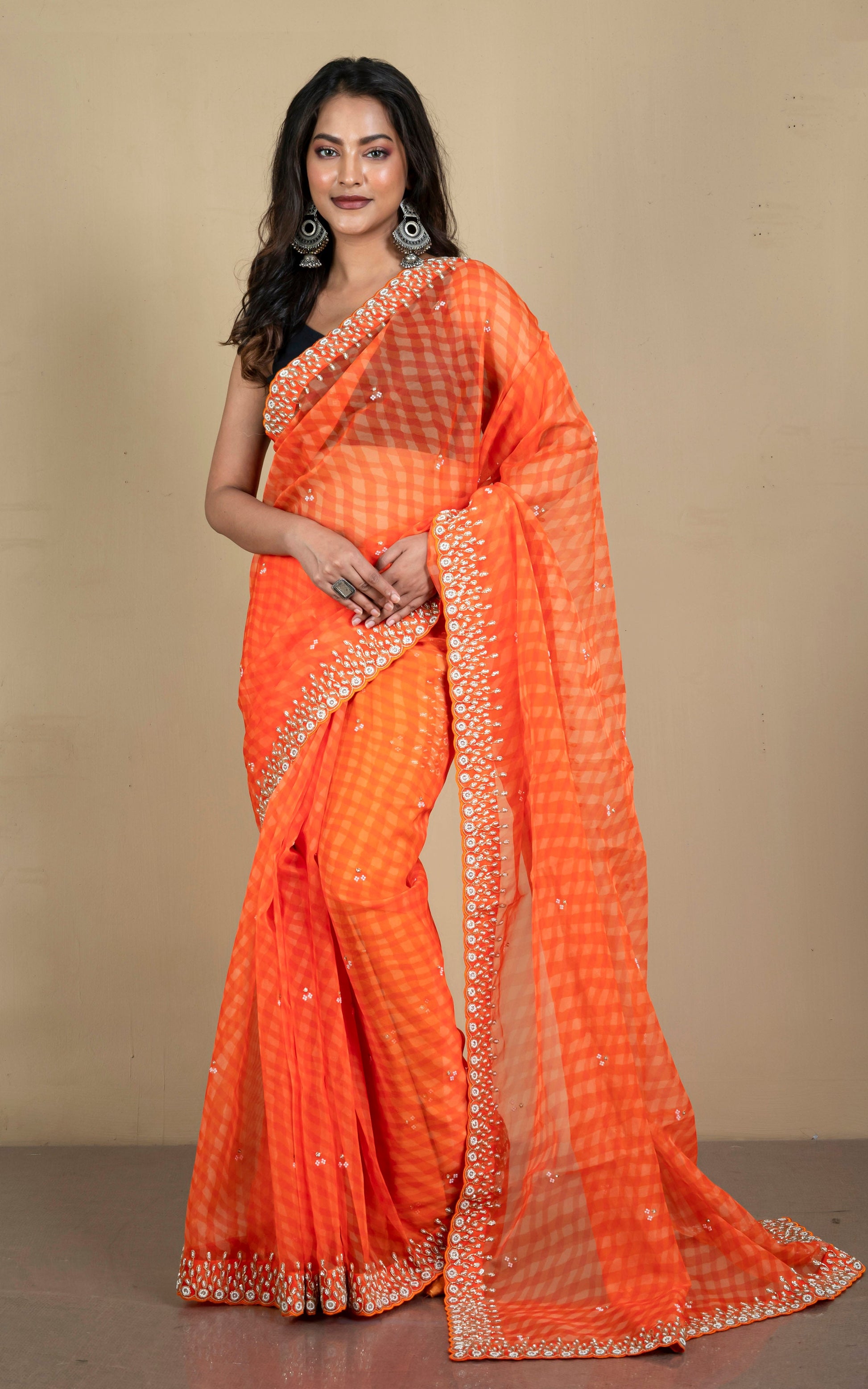 Bold and Fashionable Soft Organza Zardozi Silk Saree in Orange and Beige