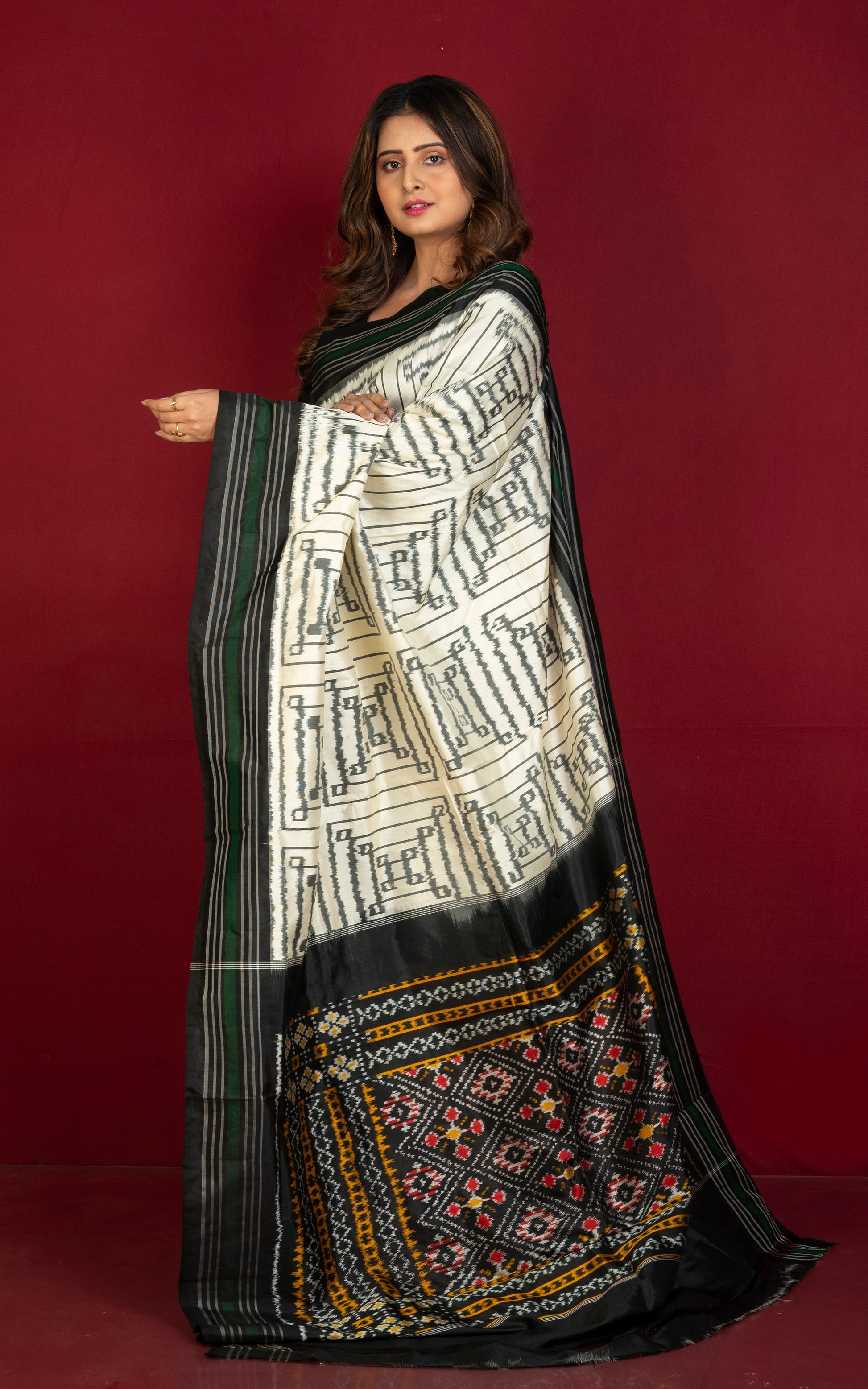 Exclusive Twill Ikkat Pochampally Silk Saree with Madhathasu Pallu in Off White, Black, Dark Green and Multicolored