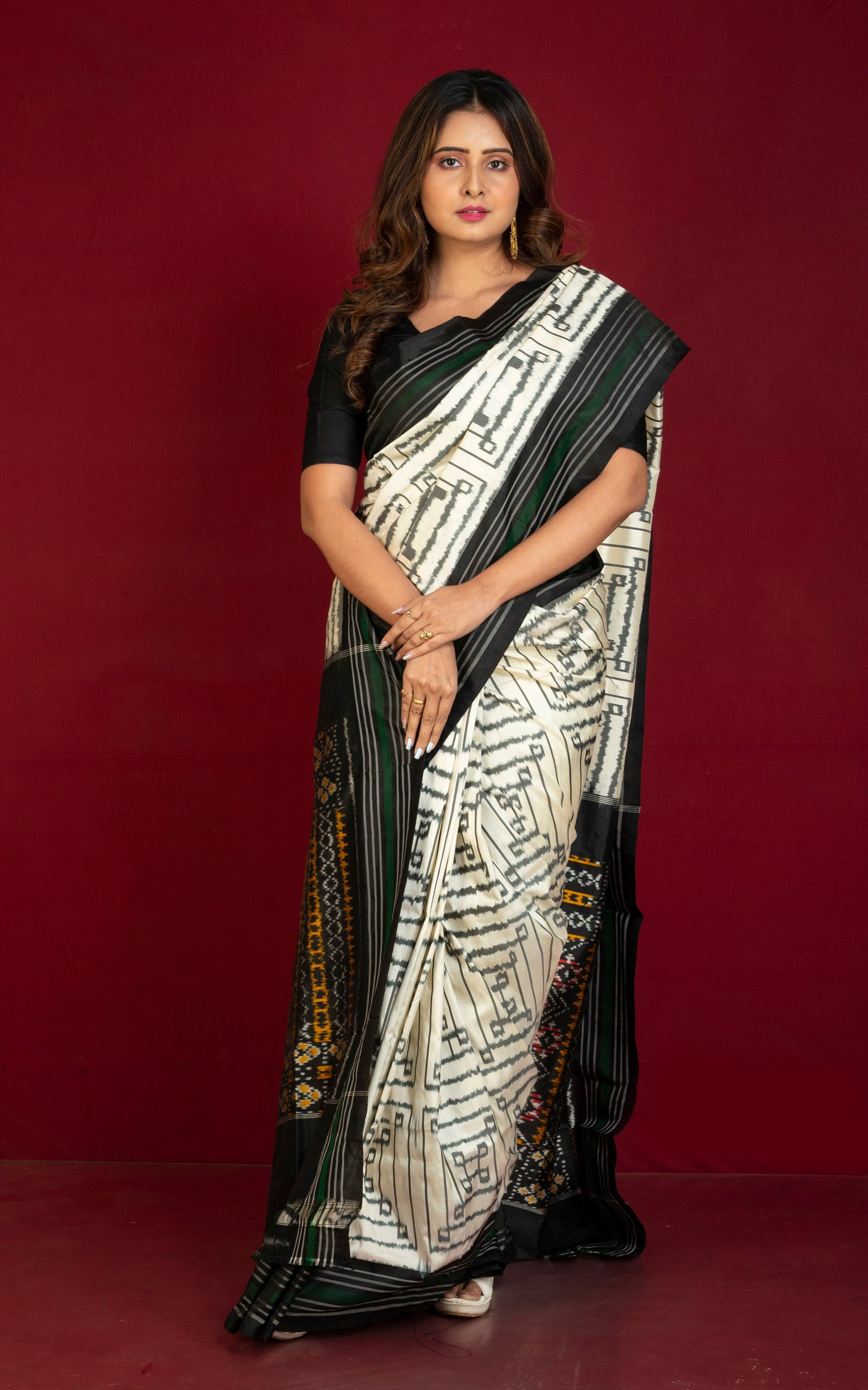 Exclusive Twill Ikkat Pochampally Silk Saree with Madhathasu Pallu in Off White, Black, Dark Green and Multicolored