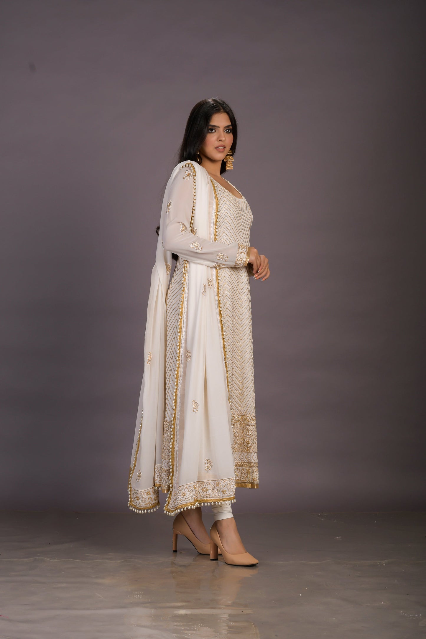 A Classic Cream Chikankari Suit With Gold And Pearl Embellishments