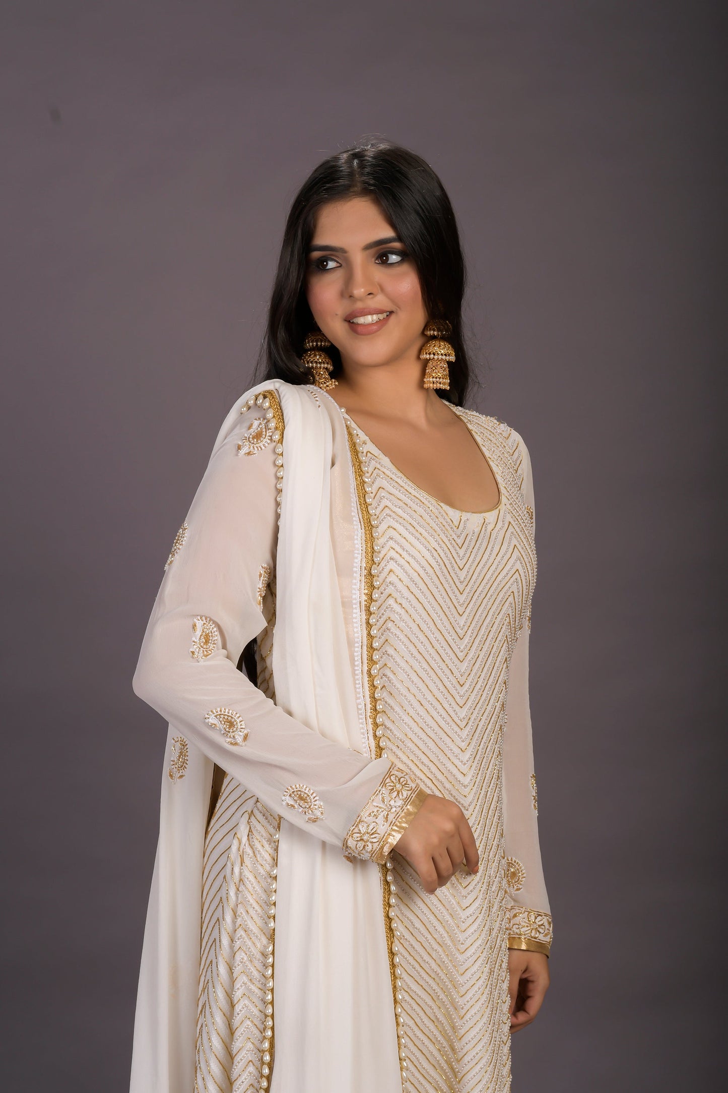 A Classic Cream Chikankari Suit With Gold And Pearl Embellishments